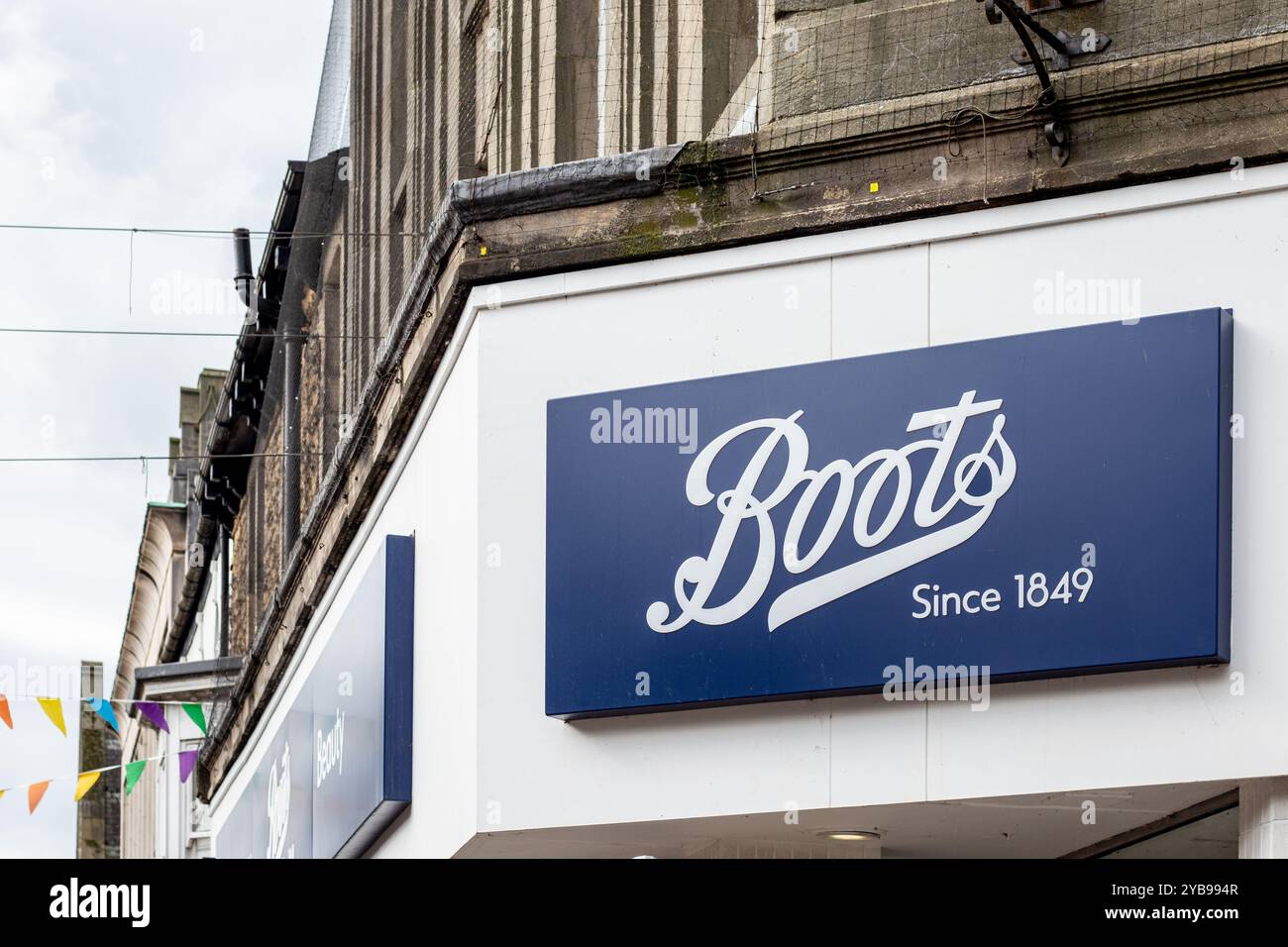A close-up view of a Boots store sign, featuring the brand name 'Boots ...