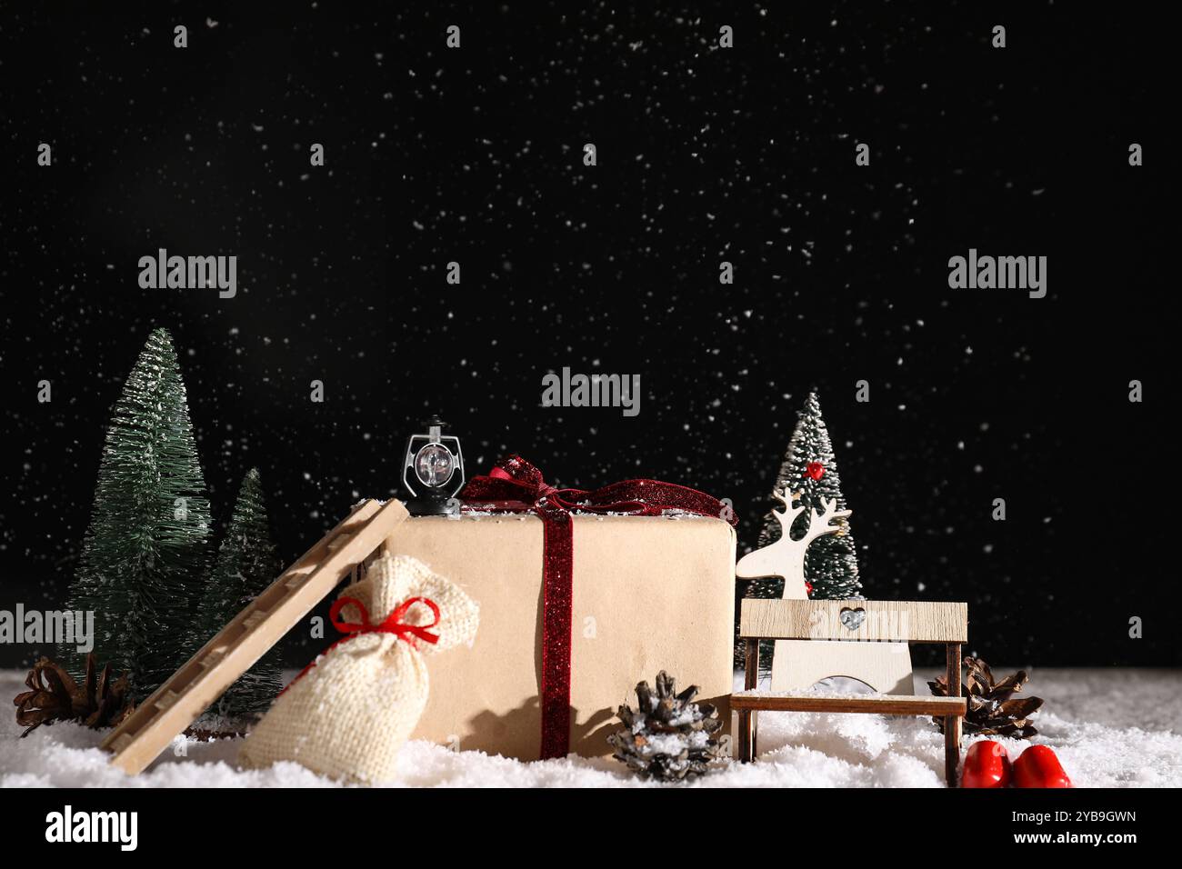 Beautiful composition with gift box, Christmas fir trees and different ...