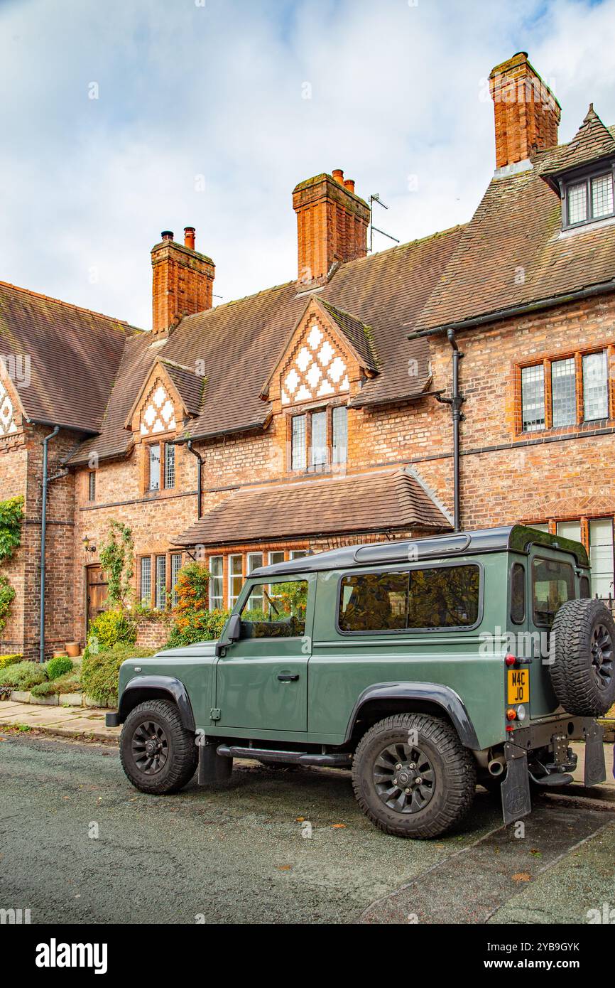 Land rover defender parked outside cottages in the Cheshire village of ...