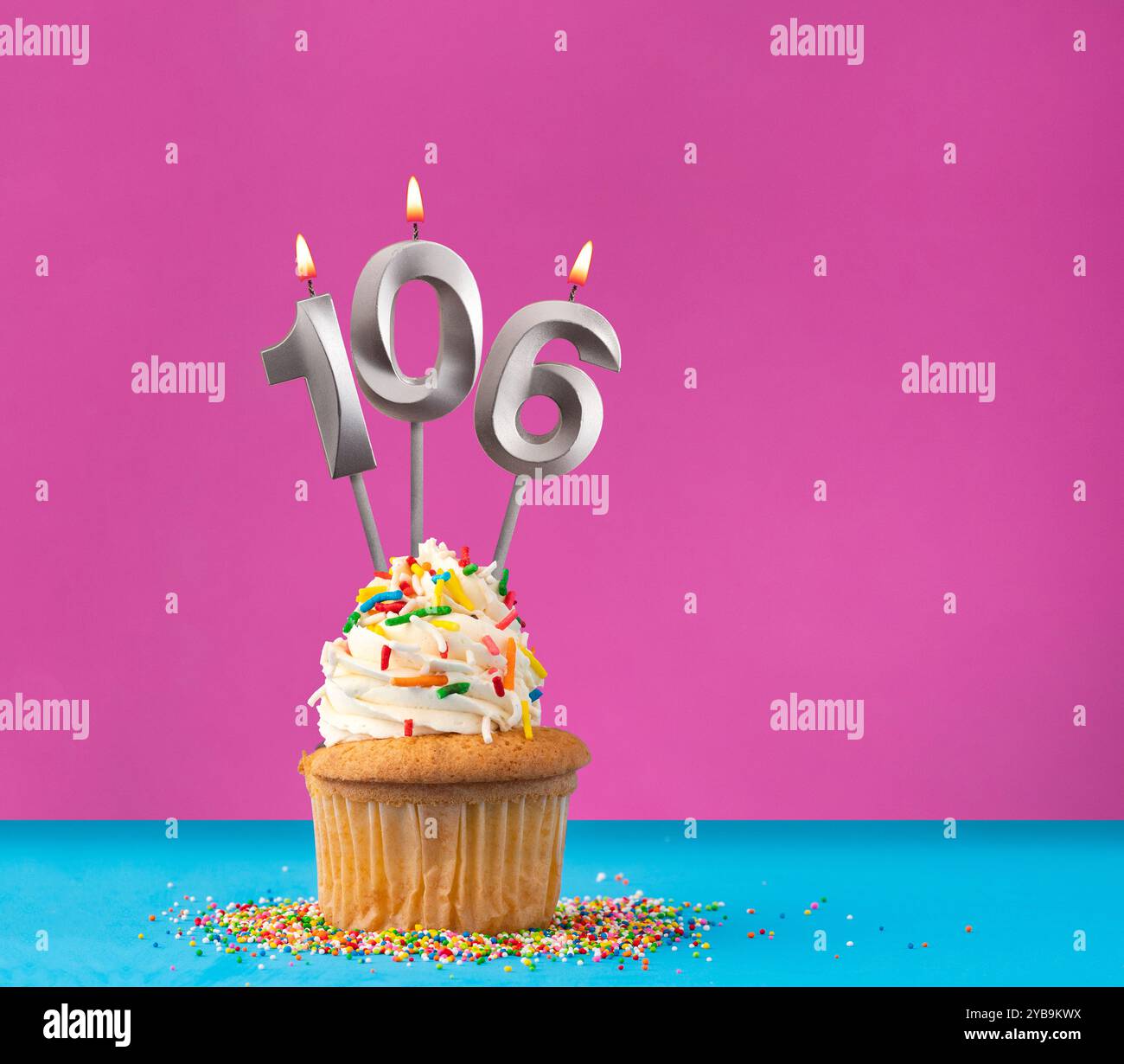Lit birthday candle with the number 106 - Celebration card on violet ...