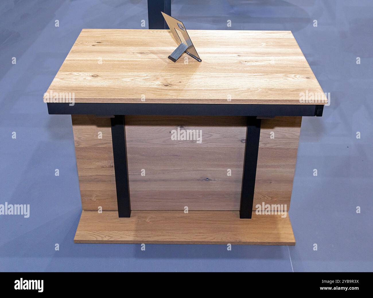 Simple wooden table furniture with picture frame on top Stock Photo - Alamy