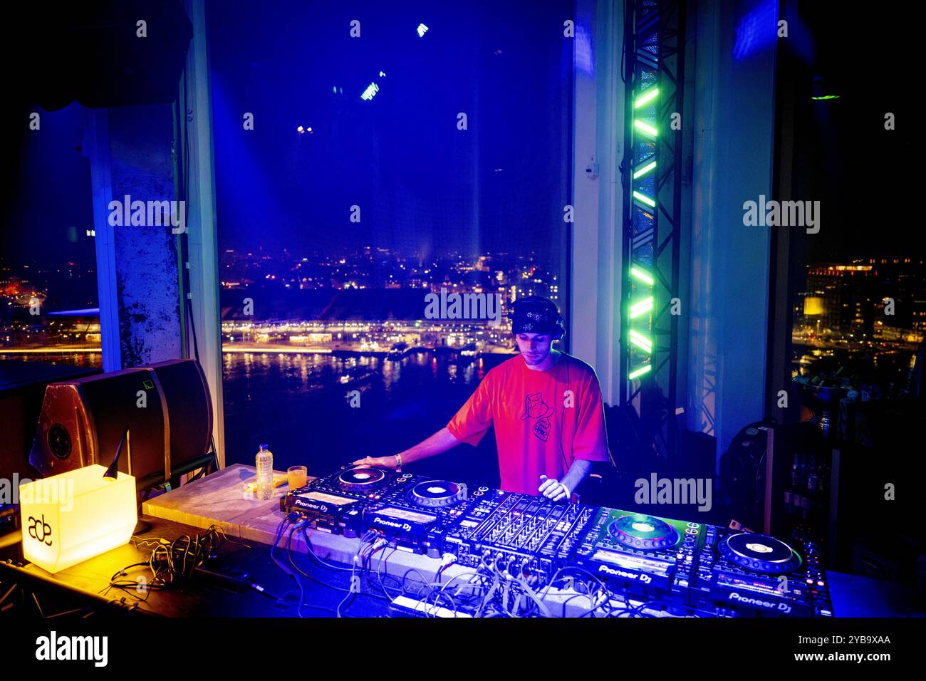 AMSTERDAM - A DJ during a show by DJ EZ, Trippy Tins, Yung Singh and SAIDAH at the A'DAM Tower. The concert is part of the Amsterdam Dance Event (ADE), a multi-day music event with parties and concerts throughout the city. ANP ROBIN UTRECHT netherlands out - belgium out Stock Photo