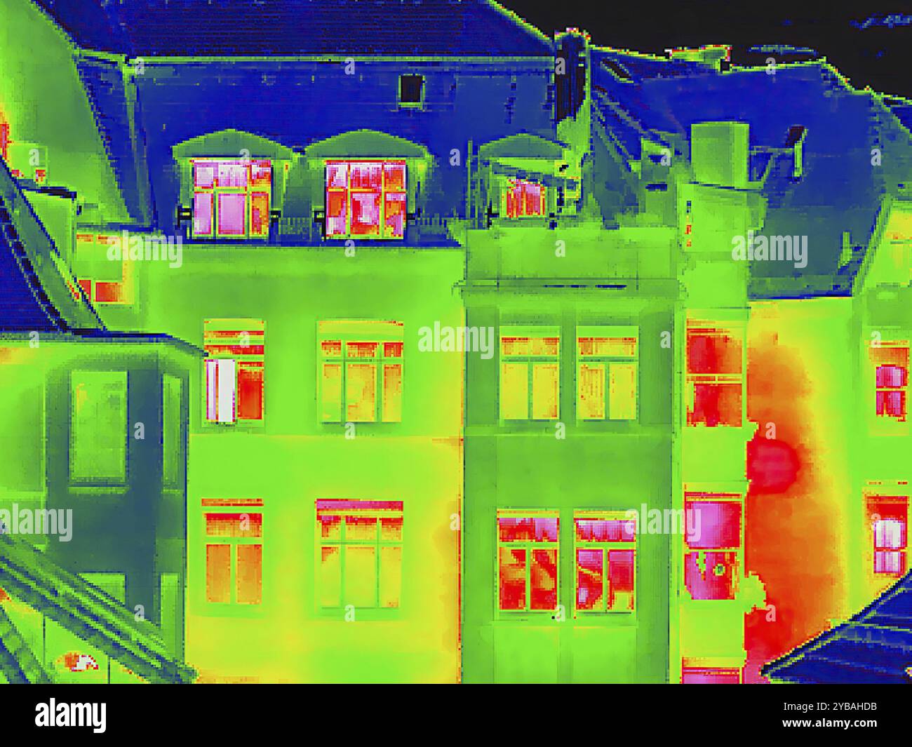Apartment block, facade of a residential building with windows. Thermal image or thermography, symbol photo, interpolated. Germany Stock Photo
