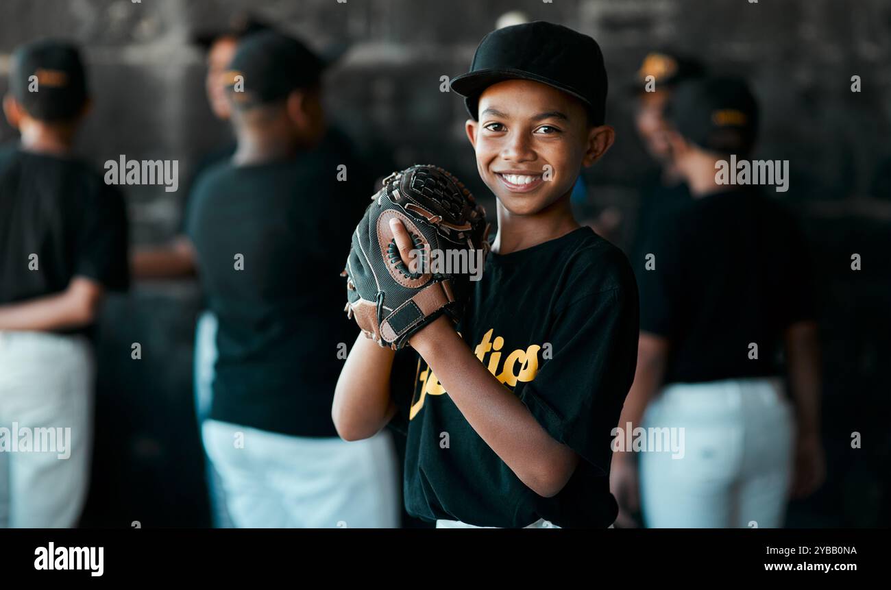 Portrait, boy and happy as baseball player at field for match, tournament and challenge in California. Male person, kid and smile or satisfied with Stock Photo