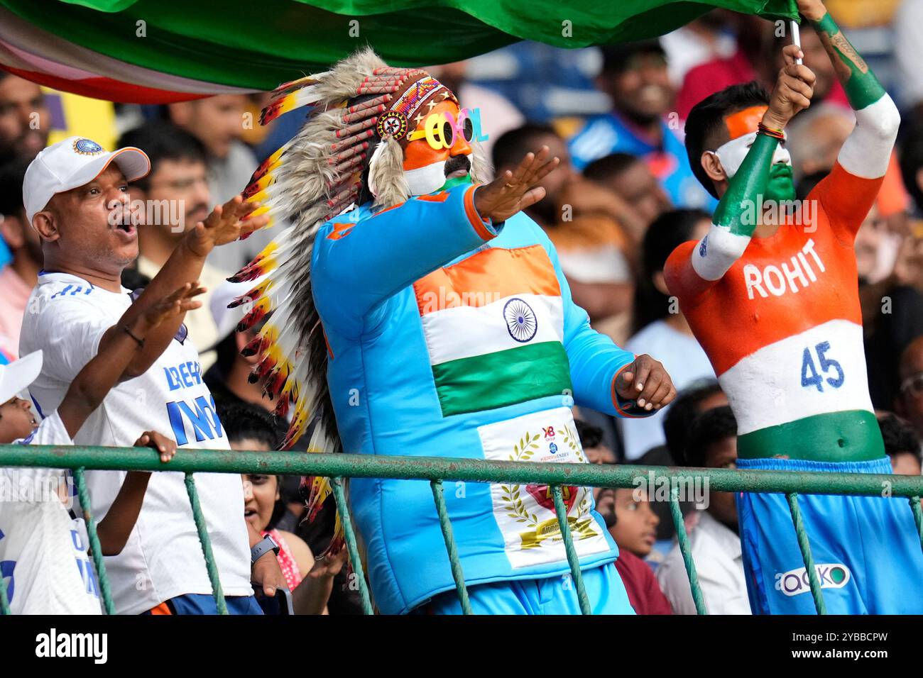 Fans react after India's captain Rohit Sharma hit a boundary during the ...