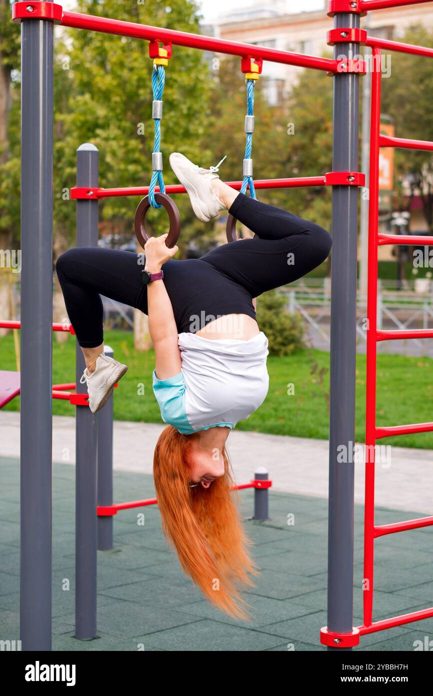 Woman hanging upside down on hi-res stock photography and images - Alamy