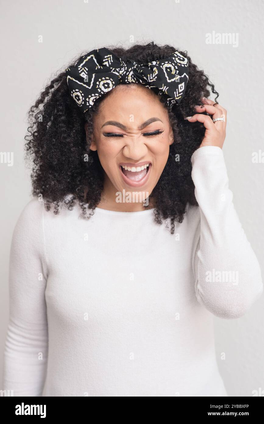 African woman screaming hair hi-res stock photography and images - Alamy