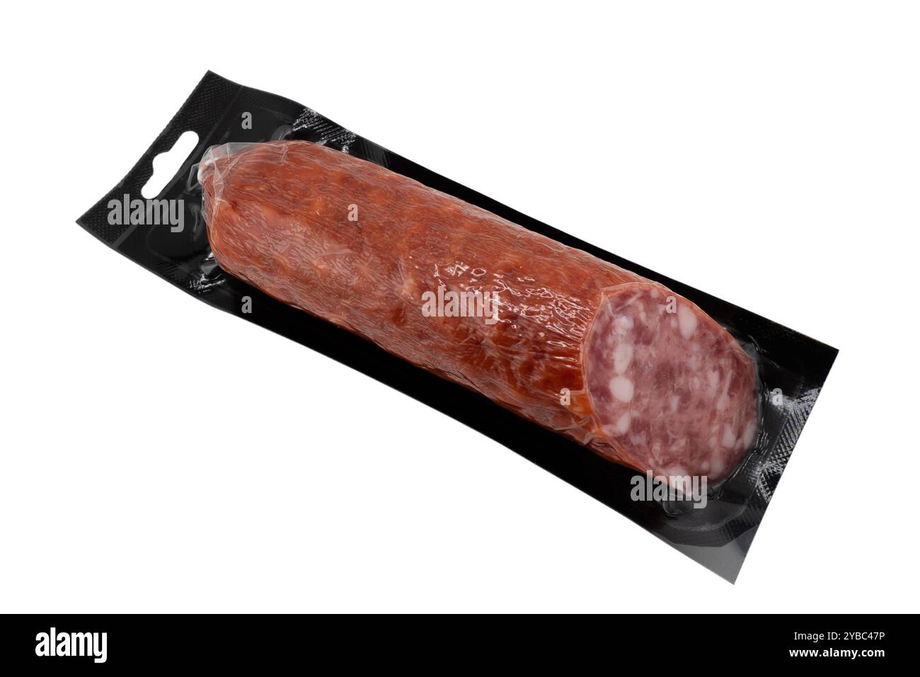 Top view of smoked meat salami in vacuum package isolated on black background. Raw smoked salami sausage isolated Stock Photo