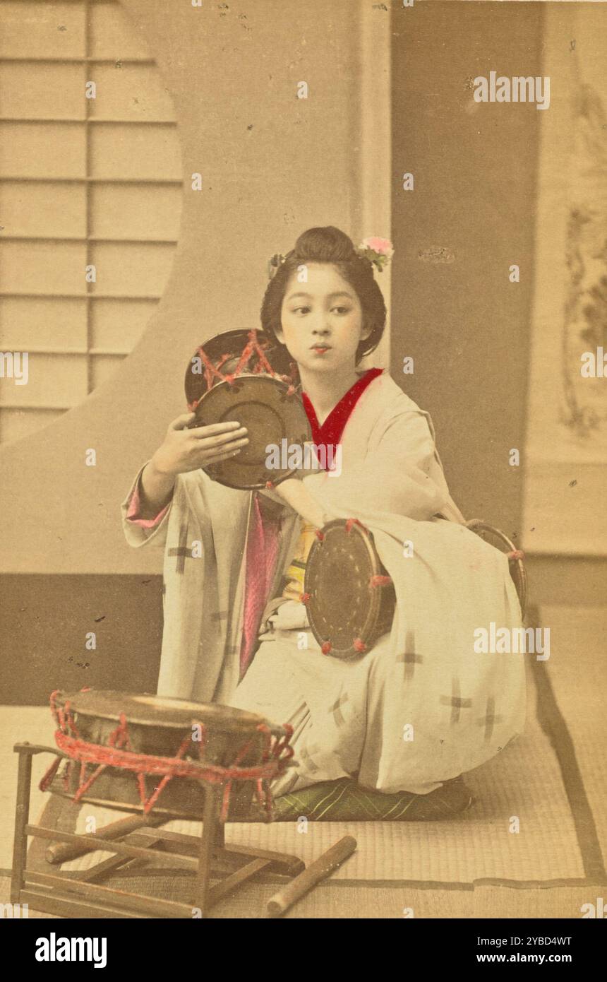 Girl Beating a Tsuzumi, 1897. Stock Photo