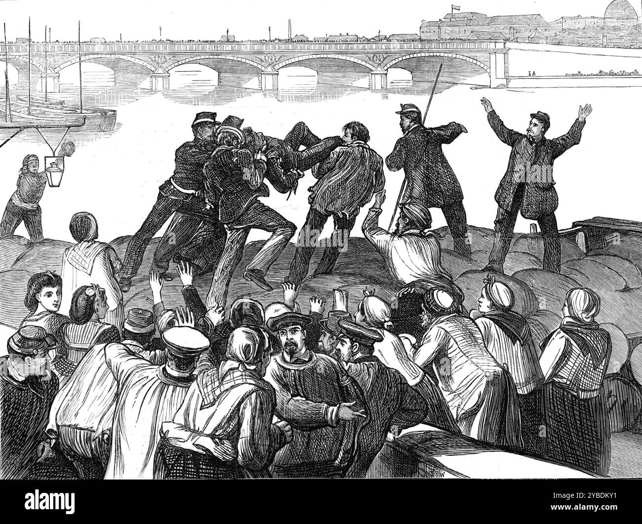 Mob of Paris rioters drowning a police agent, 1871. Franco-Prussian War: '...a band of 200 people, yelling at the heels of a respectably-dressed individual, whom two chasseurs-a-pied were holding by the collar. Shouts of his being a police spy, and demanding his death, were raised on all sides, as he was dragged in the direction of the canal, where his captors proposed to drown him...the mob...assailed him with kicks and blows...Already half murdered, he entreated that he might be permitted to blow his brains out...this request was denied him, and he was hurried along to the Quai Henri IV., wh Stock Photo