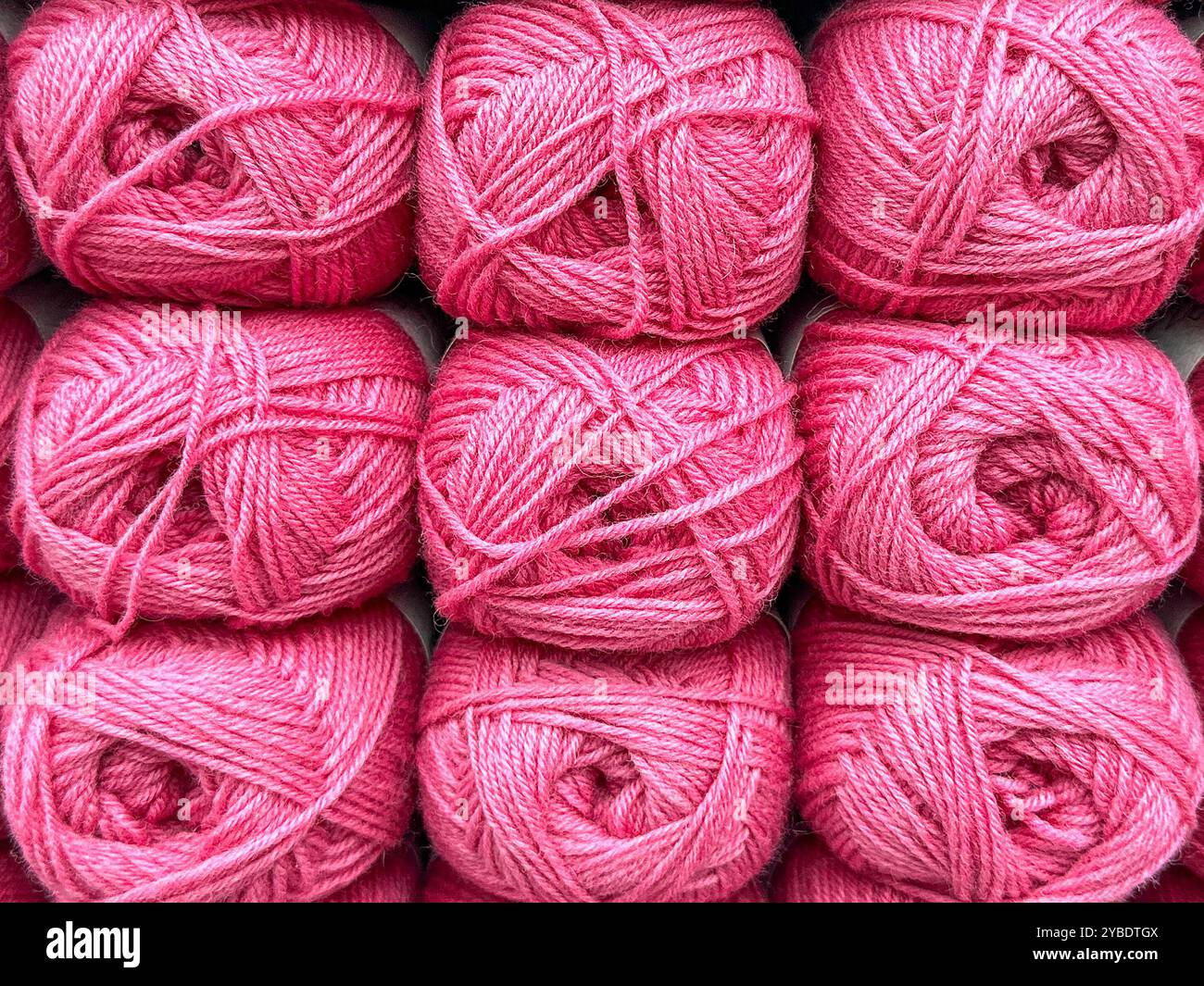 Close up view of balls of pink wool. - Smartphone Captured Stock Image