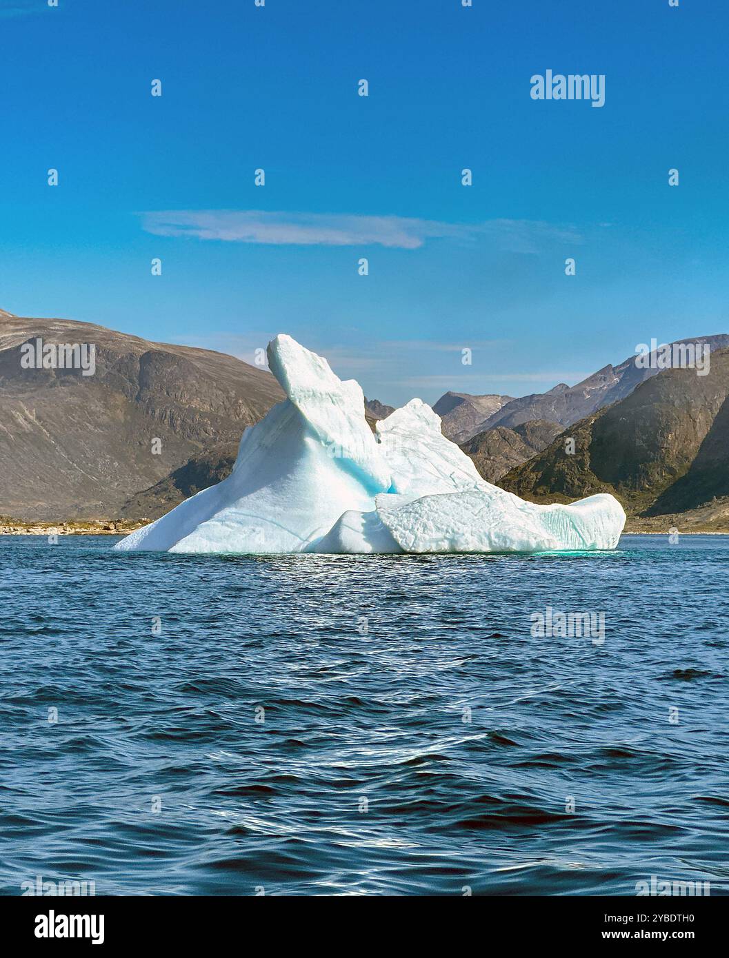 Scenic view of a large iceberg on a blue sea in Greenland - Smartphone Captured Stock Image