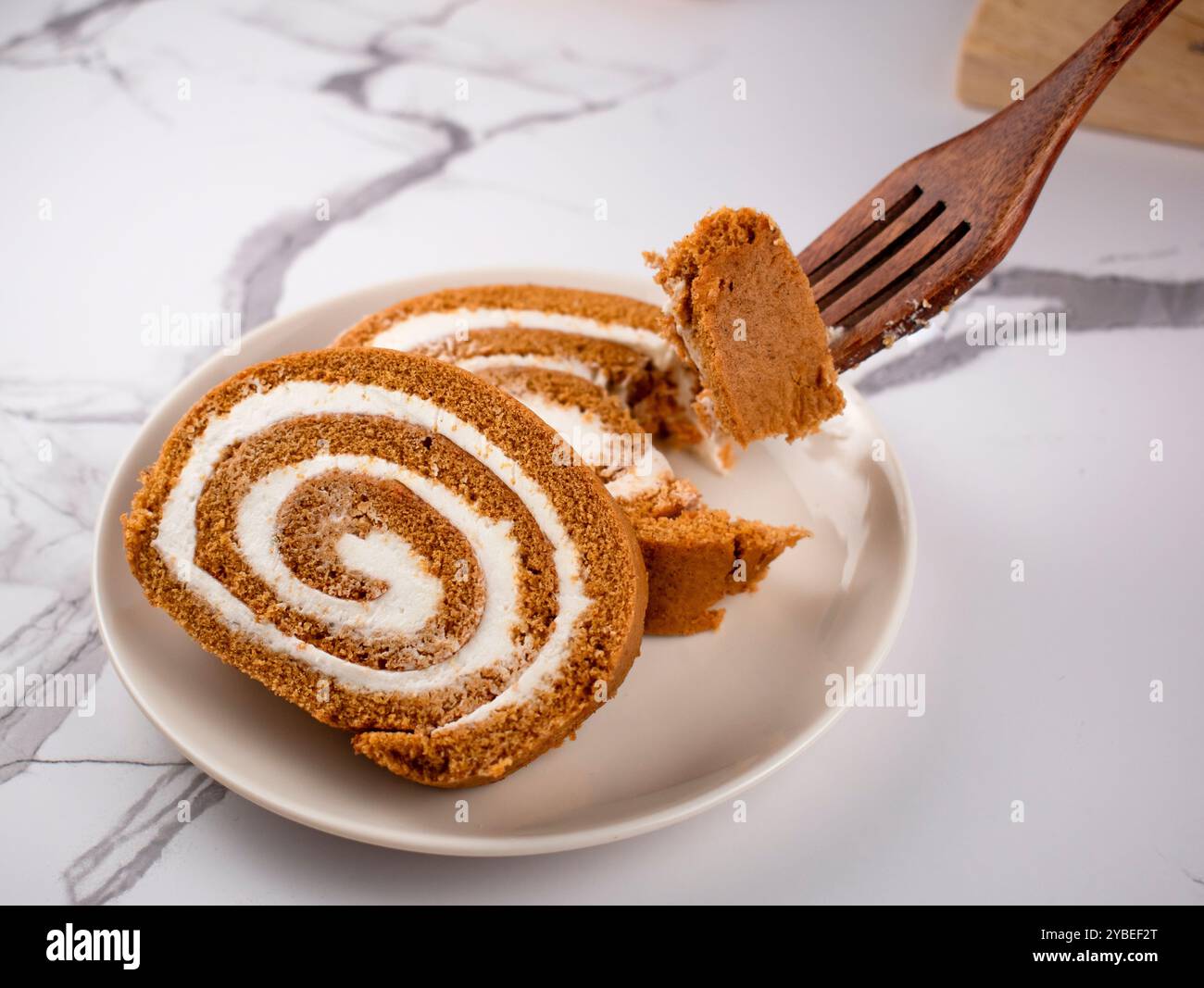 Pumpkin Swiss Roll being served Stock Photo