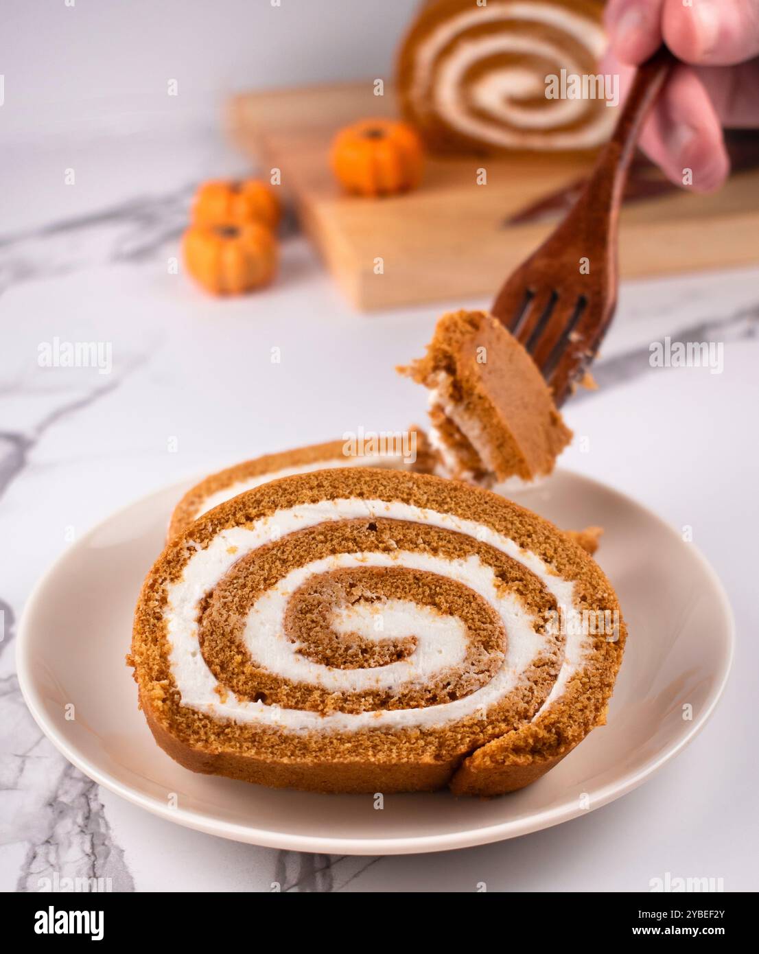 Pumpkin Swiss Roll being served Stock Photo