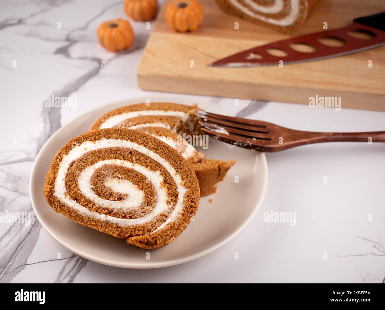 Pumpkin Swiss Roll being served Stock Photo