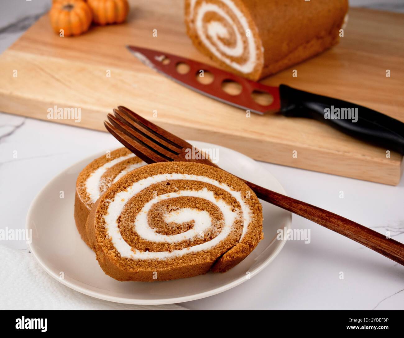 Pumpkin Swiss Roll being served Stock Photo