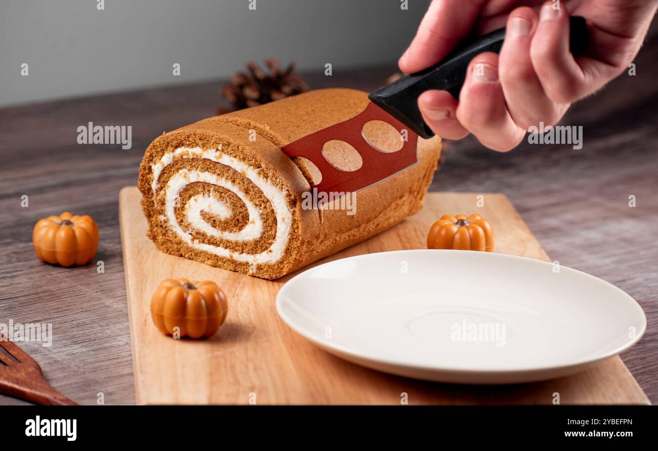 Pumpkin Swiss Roll being served Stock Photo
