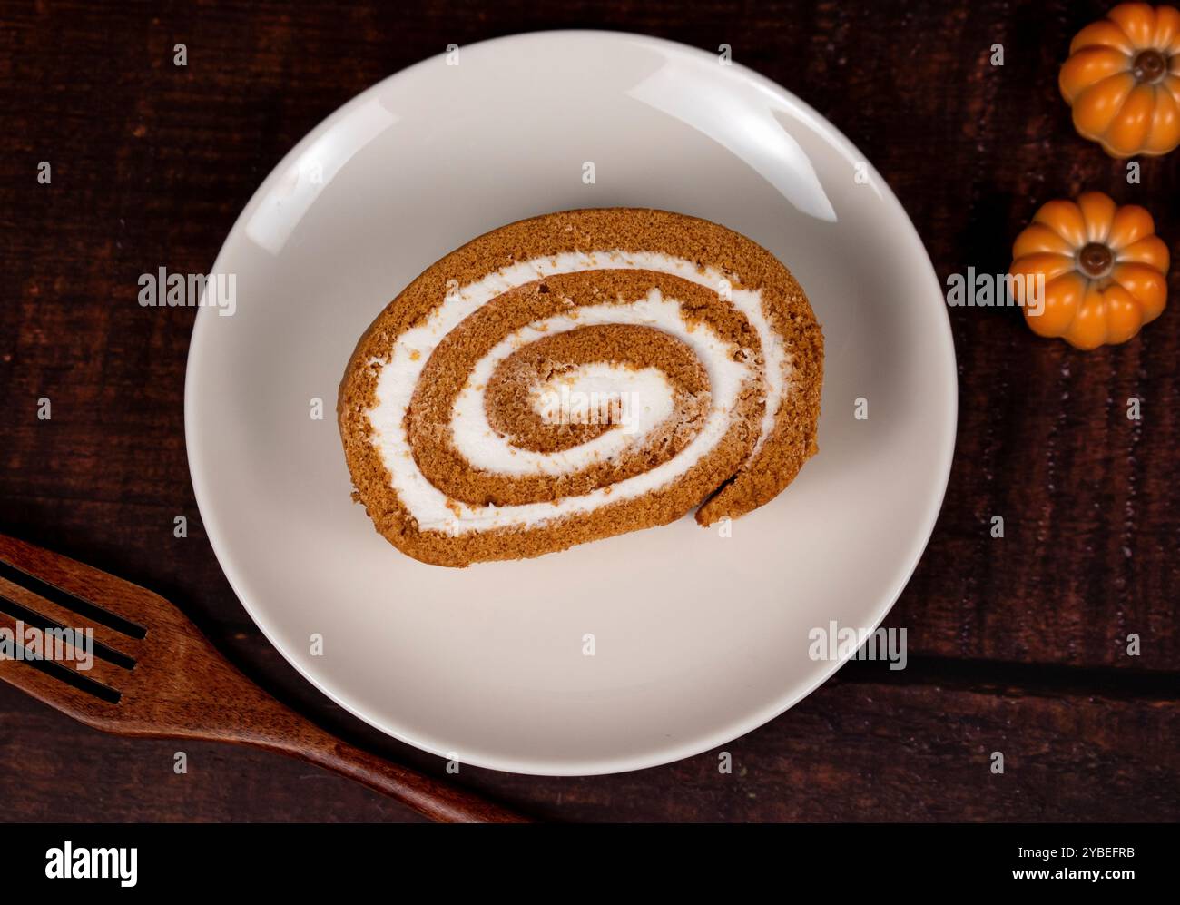 Pumpkin Swiss Roll being served Stock Photo