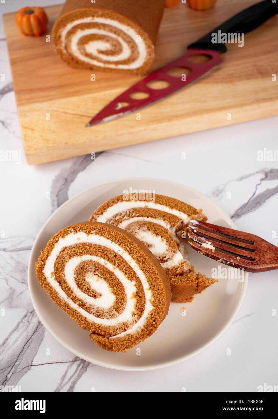 Pumpkin Swiss Roll being served Stock Photo