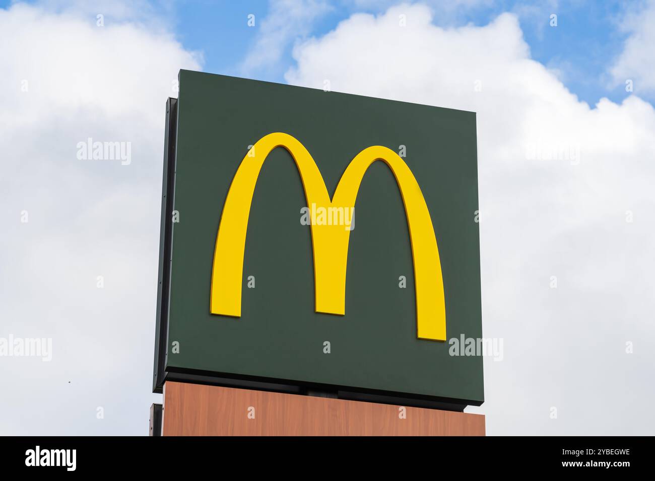 Newport, Shropshire, UK – October 17 2024:  External signage board of worldwide fast food restaurant, Mcdonalds showing the golden arches Stock Photo