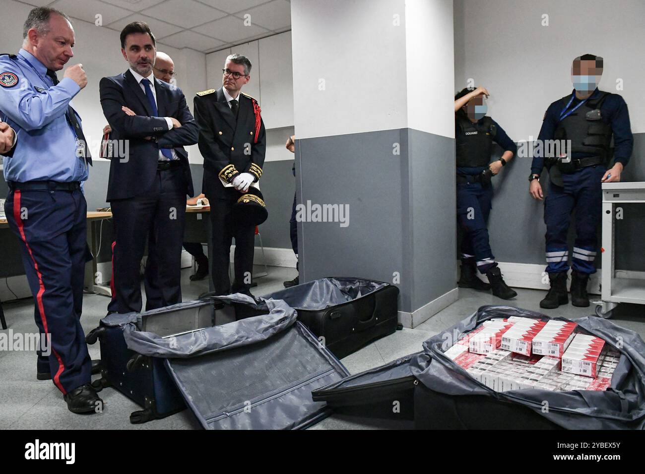 Paris, France. 18th Oct, 2024. French Minister of the Budget and Public  Accounts Laurent Saint-Martin looks at illegal smuggled cigarettes during a  visit to the customs centre at Roissy-Charles-de-Gaulle airport near Paris