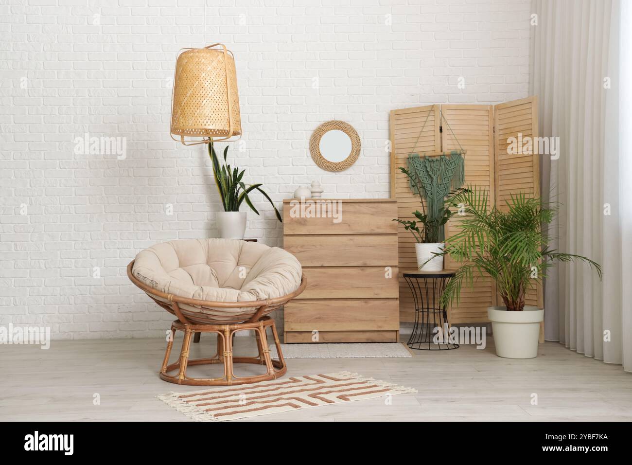 Interior of living room with mirror, commode and armchair Stock Photo ...