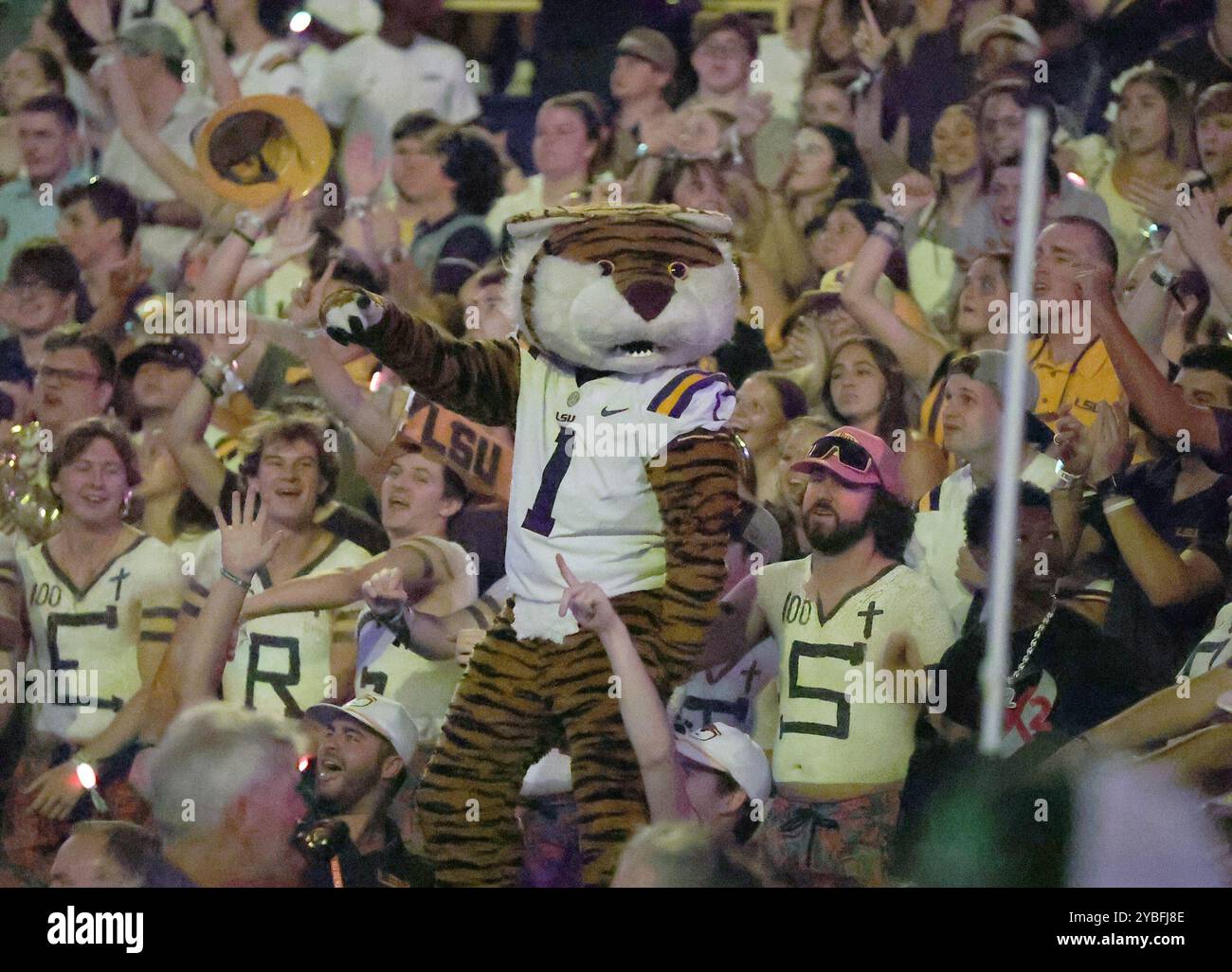 Baton Rouge, United States. 12th Oct, 2024. LSU Tigers mascot Mike the Tiger dance amongst the students during a college football game at Tiger Stadium on Saturday, October 12, 2024 in Baton Rouge, Louisiana. (Photo by Peter G. Forest/Sipa USA) Credit: Sipa USA/Alamy Live News Stock Photo