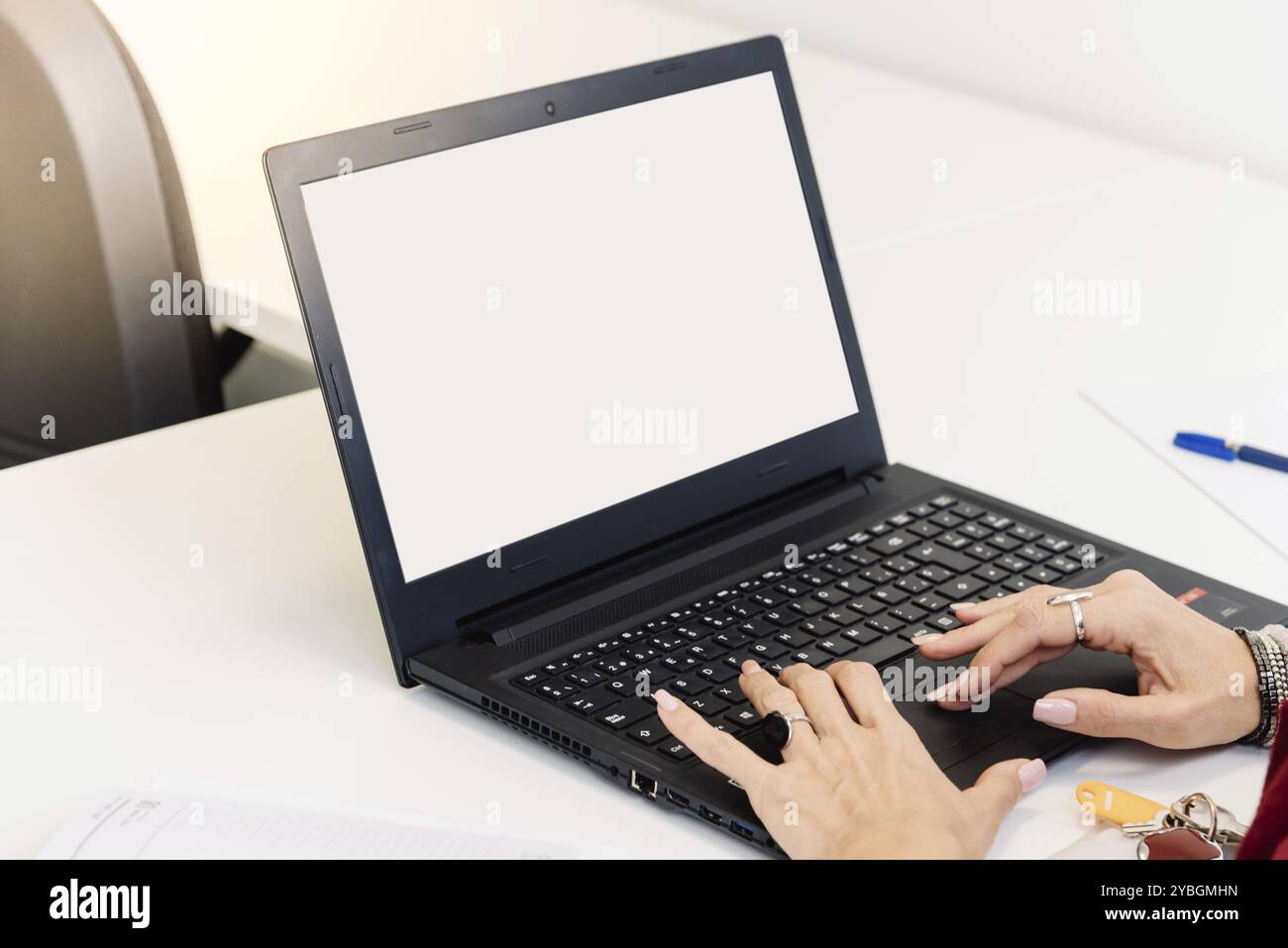 Mockup image of a woman using laptop with blank white screen Stock ...