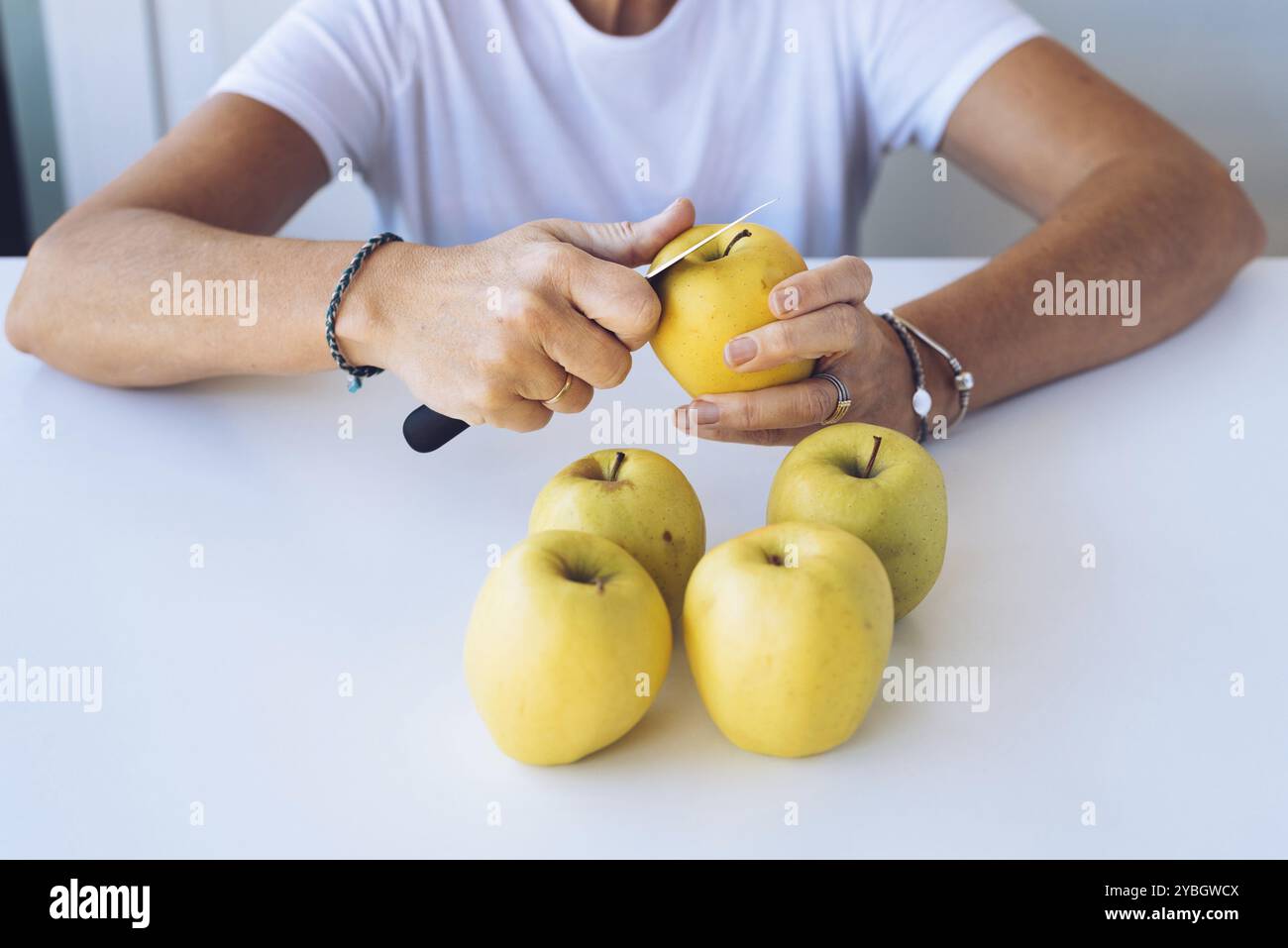 Person peeling fruit on green hi-res stock photography and images - Alamy