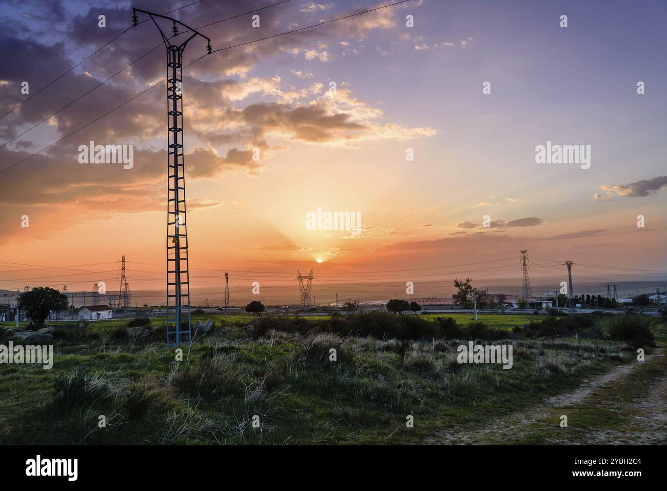 Electrical Power Lines and Pylons in the countryside at sunset Stock ...