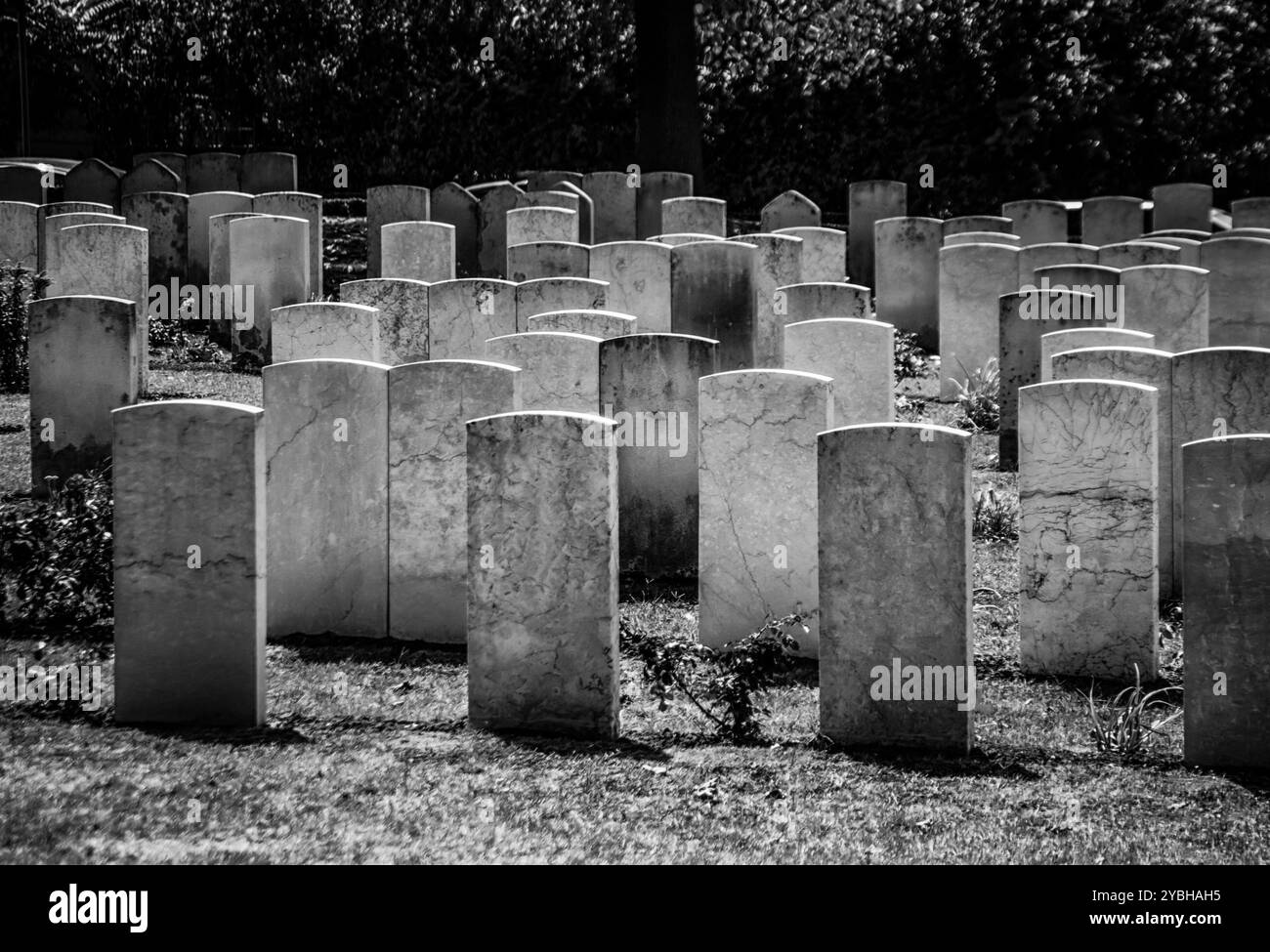 Black and white pictures of rows of graveyard stones Stock Photo