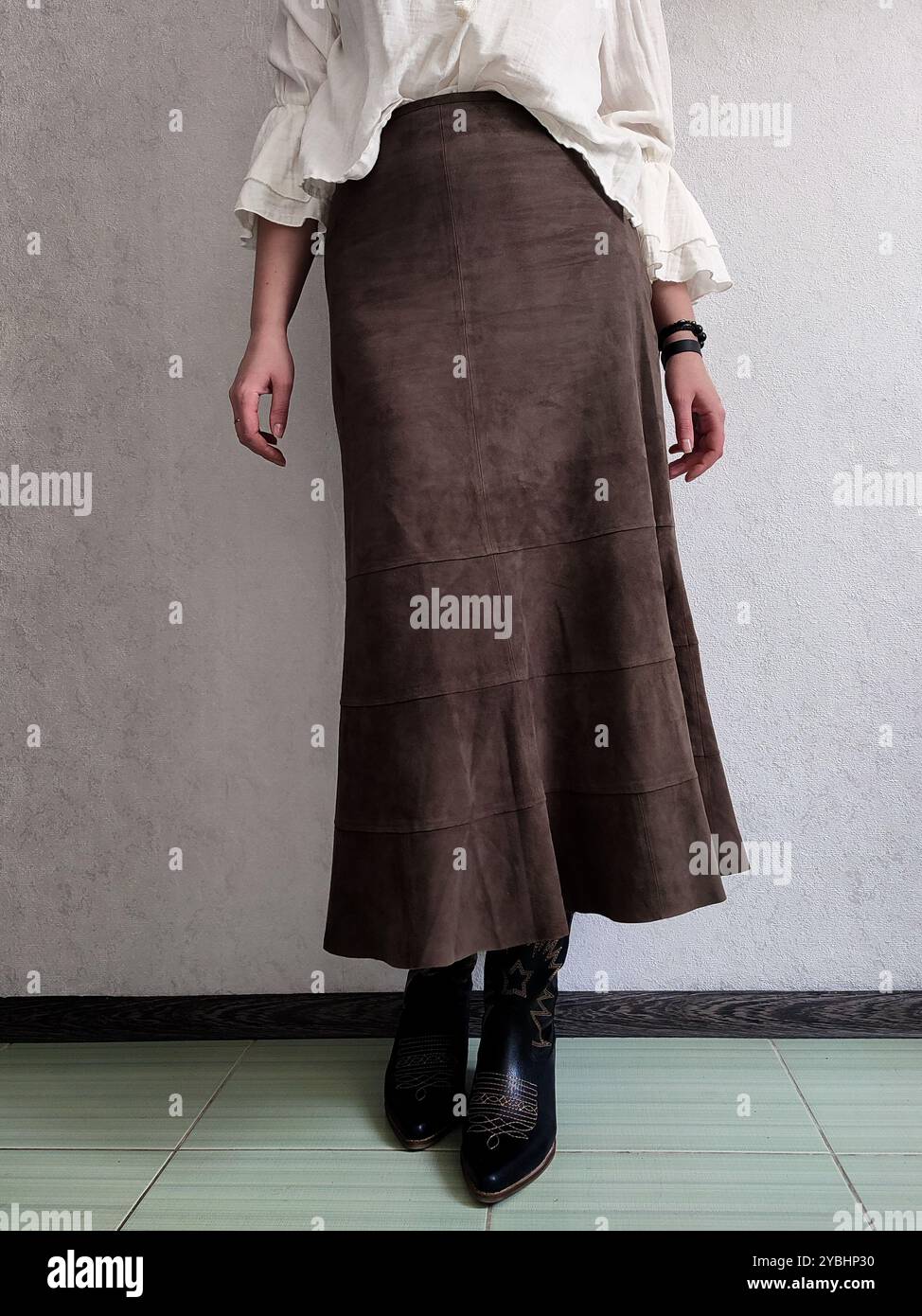 Retro Outfit, Vintage Genuine Fine Suede Leather Skirt, Cowboy Cossack Boots, White Bohemian Blouse, Front View, Outfit Details, Anonymous Woman, Brown A Line Boho Patchwork Midi Skirt, Coffee Skirt - Smartphone Captured Stock Image