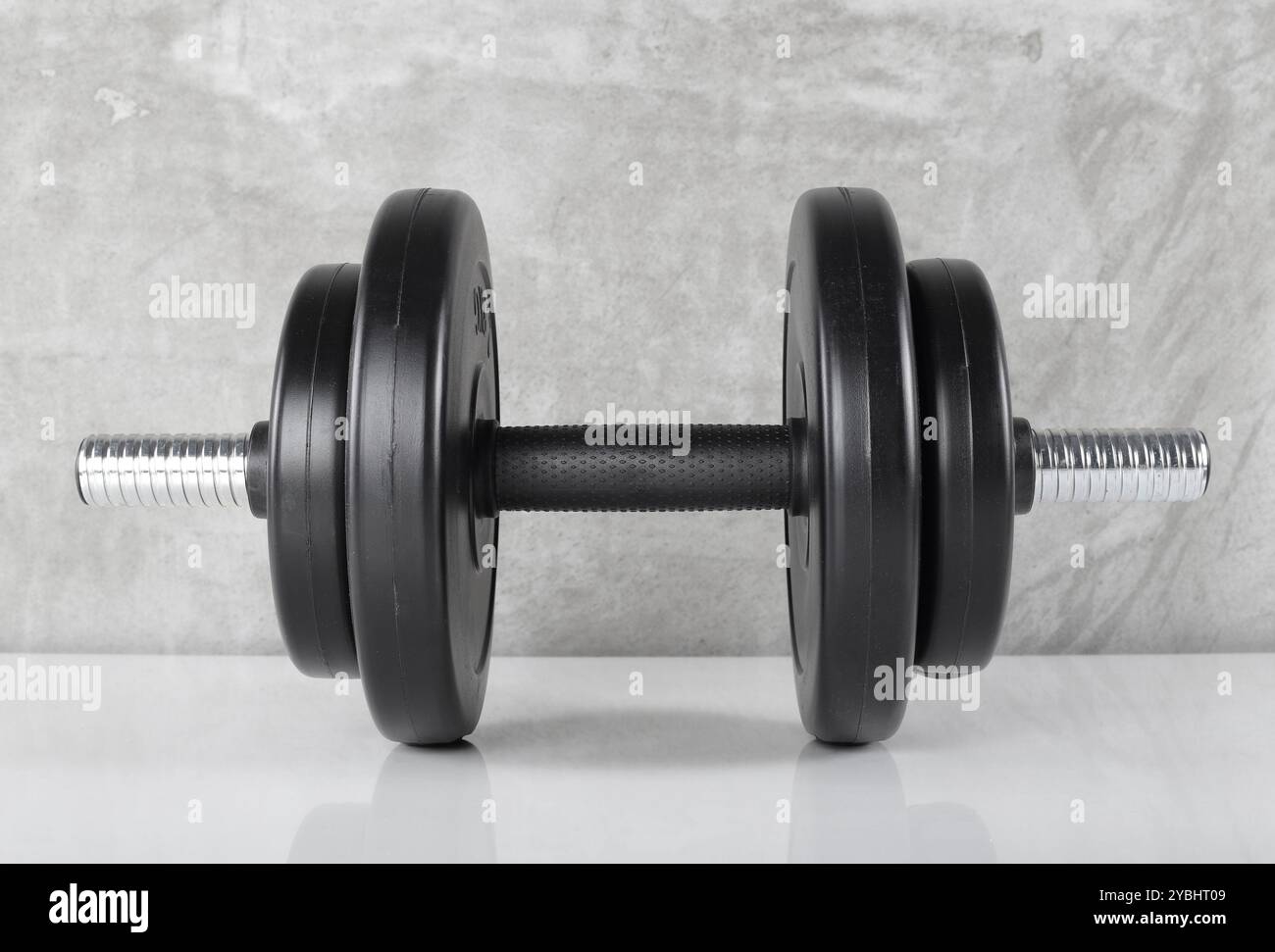 Dumbles Front View Sport and fitness - Front view Black dumbbell with four weights ...