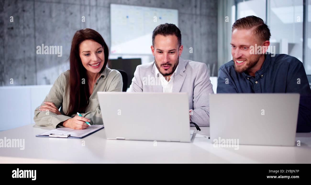 Busy Business People With Laptop. Meet Colleagues In Office Stock Photo