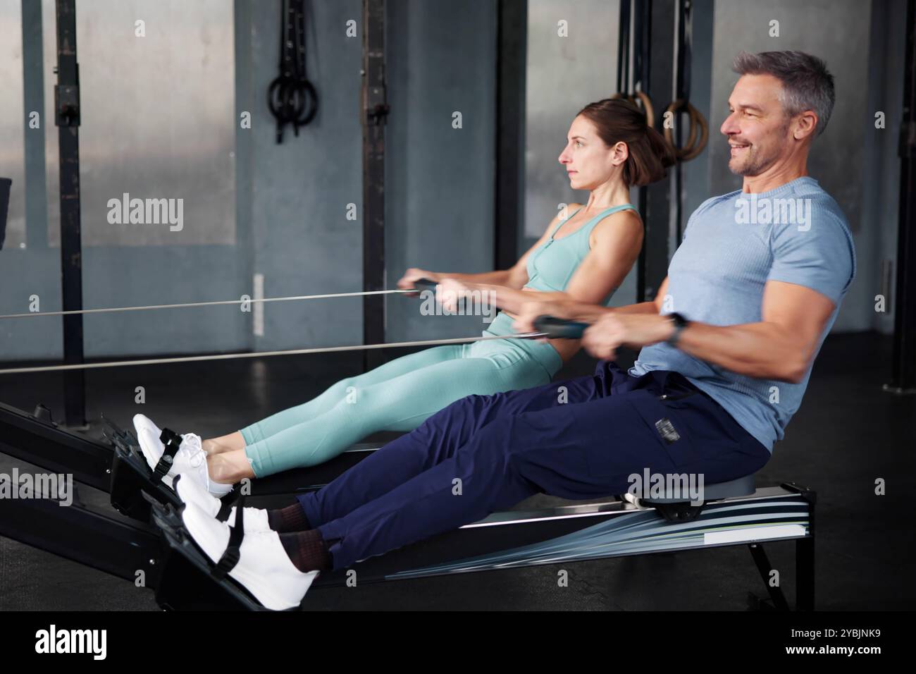Fit people using rowing machine hi-res stock photography and images - Alamy