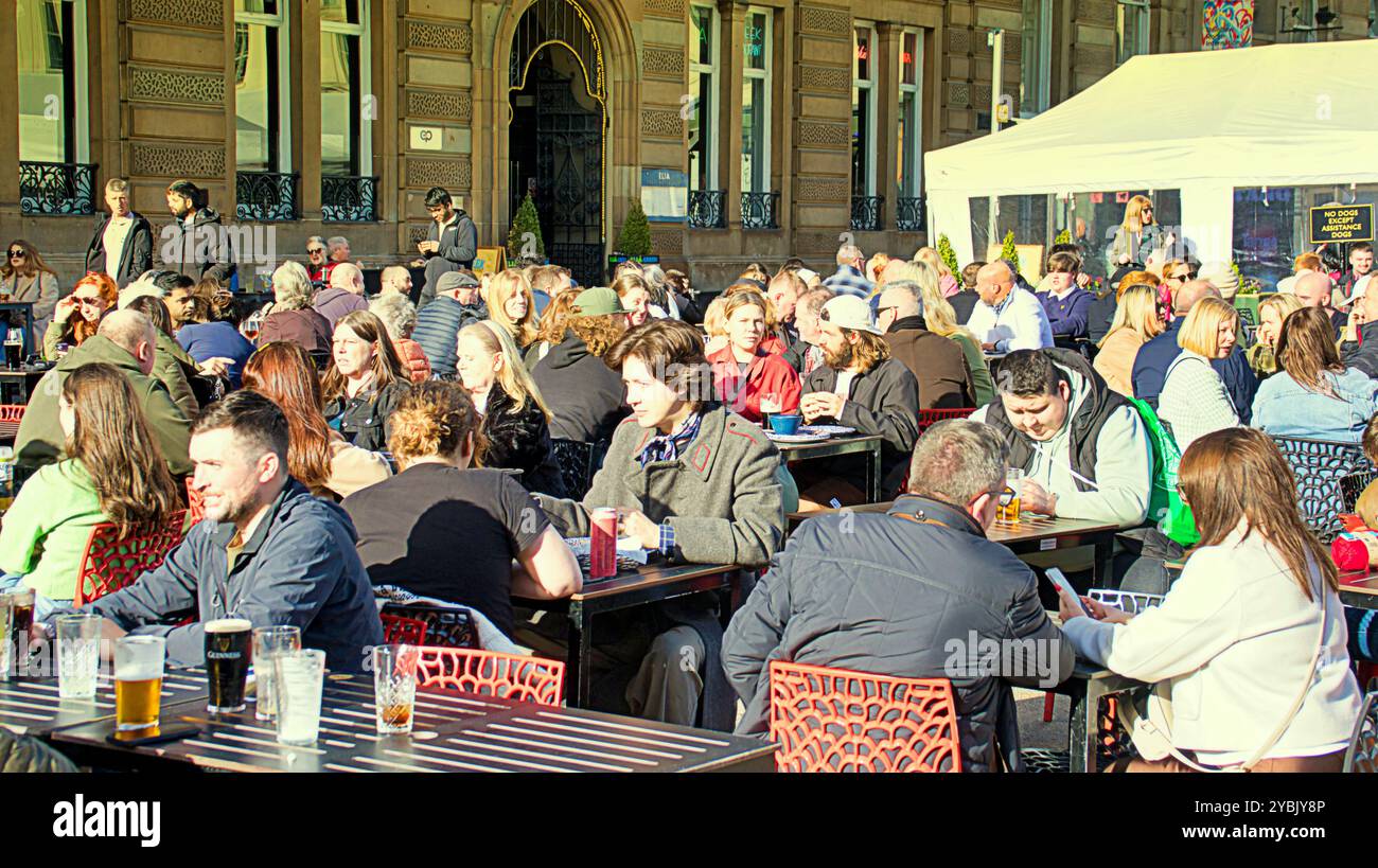 Glasgow, Scotland, UK. 19th October, 2024. UK Weather:  Cold overnight sunny ahead of storm saw locals and tourists in the centre of the city.  Busy lunchtime in george square at the counting house witherspoon pub and surrounding area. Credit Gerard Ferry/Alamy Live News Stock Photo