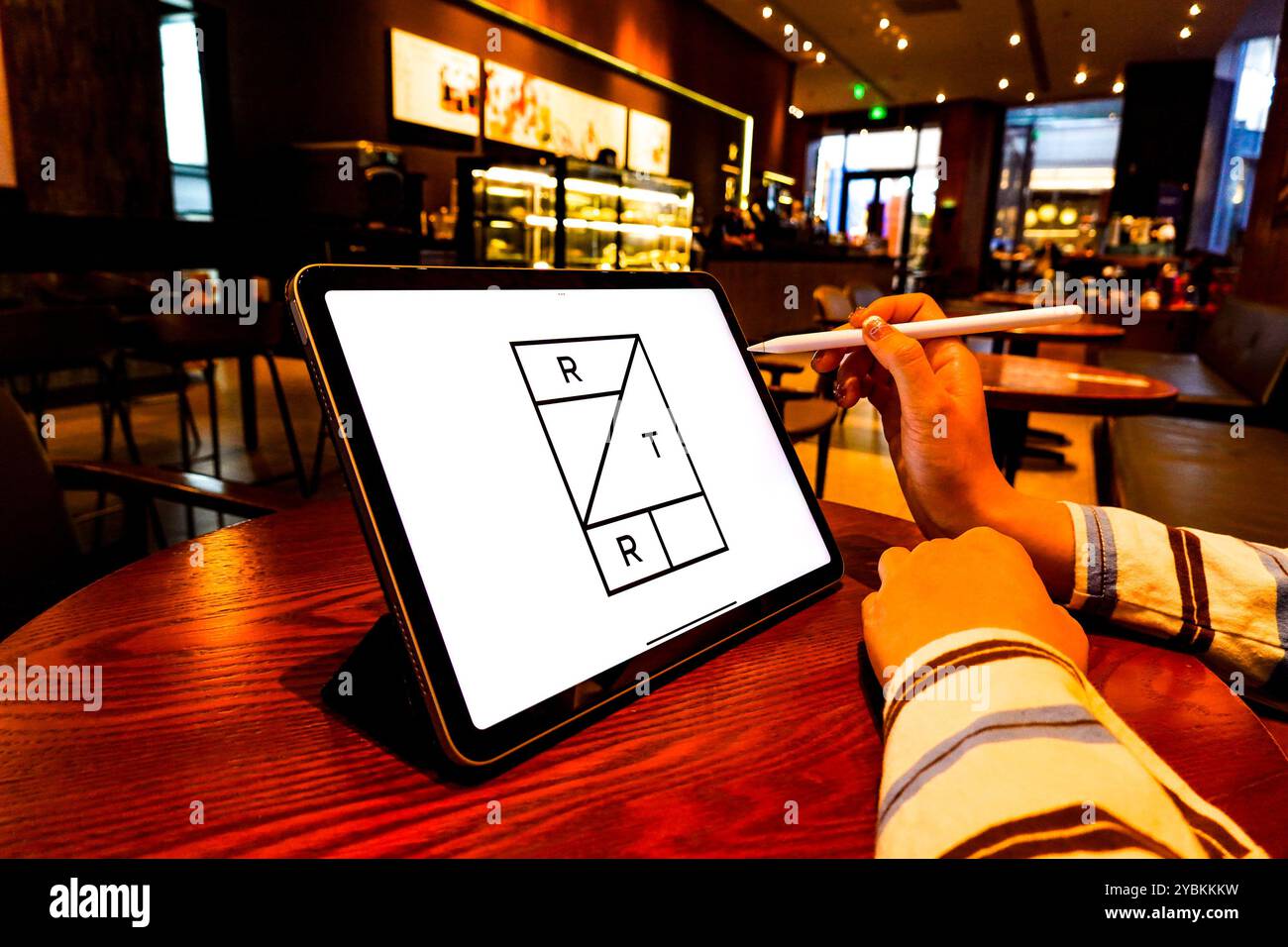 In this photo illustration, a PFSweb logo is displayed on the screen of ...