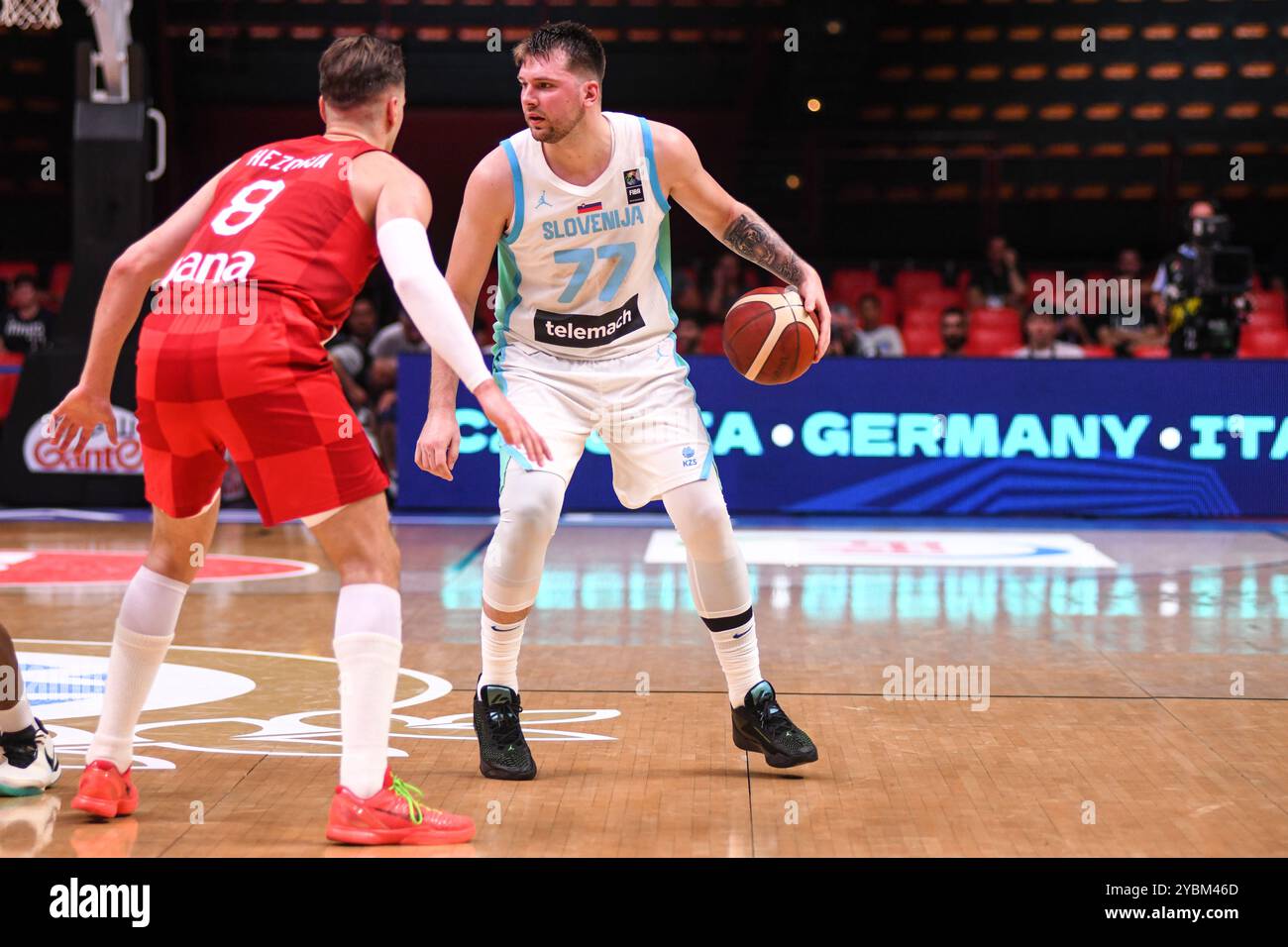 Luka Doncic (Slovenia) guarded by Mario Hezonja (Croatia). FIBA Olympic ...