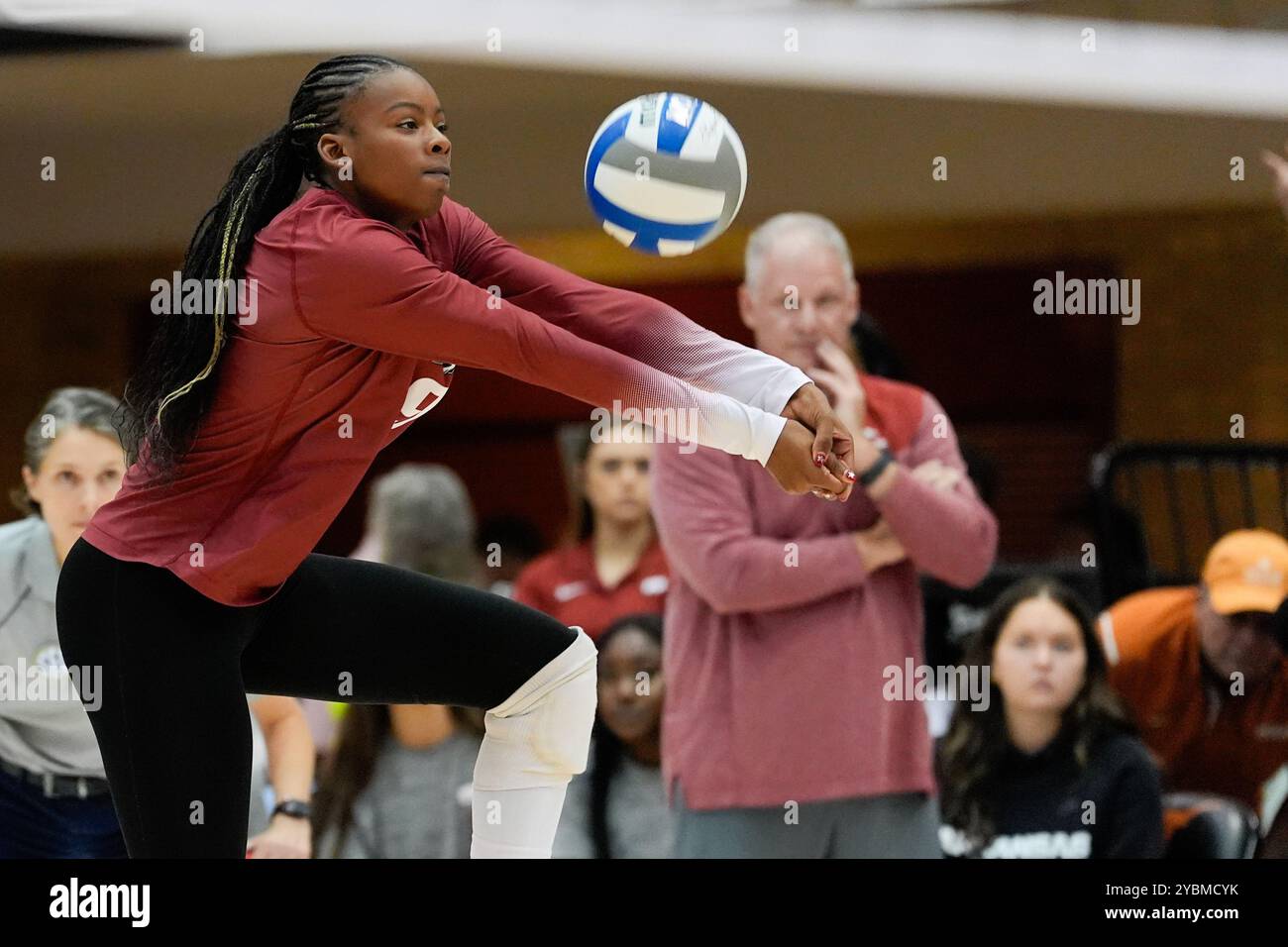 Arkansas outside hitter Aniya MadkinÂ (9) digs the ball as Arkansas