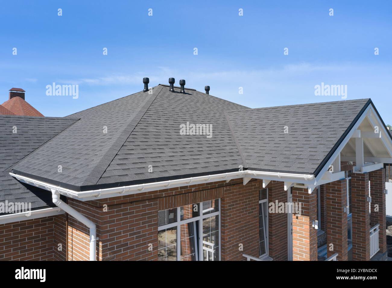 House roof with asphalt shingles Stock Photo
