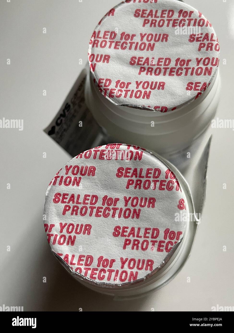 Prescription Pill Bottles with protective seals, 2024, USA - Smartphone Captured Stock Image