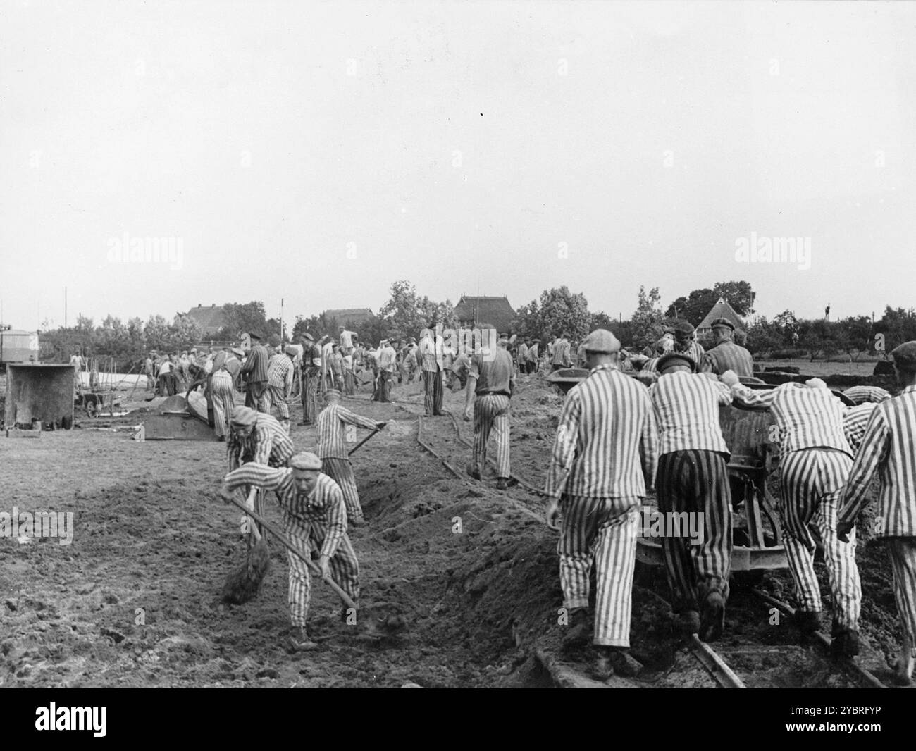 Prisoners at forced labor building the Dove-Elbe canal. The Kapos wear white and black armbands. Stock Photo