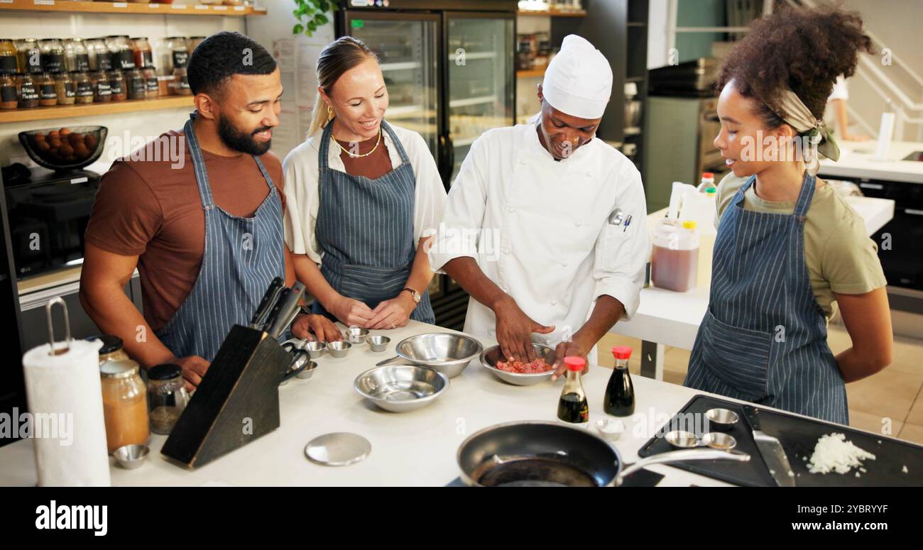 Cooking, class and chef in kitchen with meat preparation, teaching ...