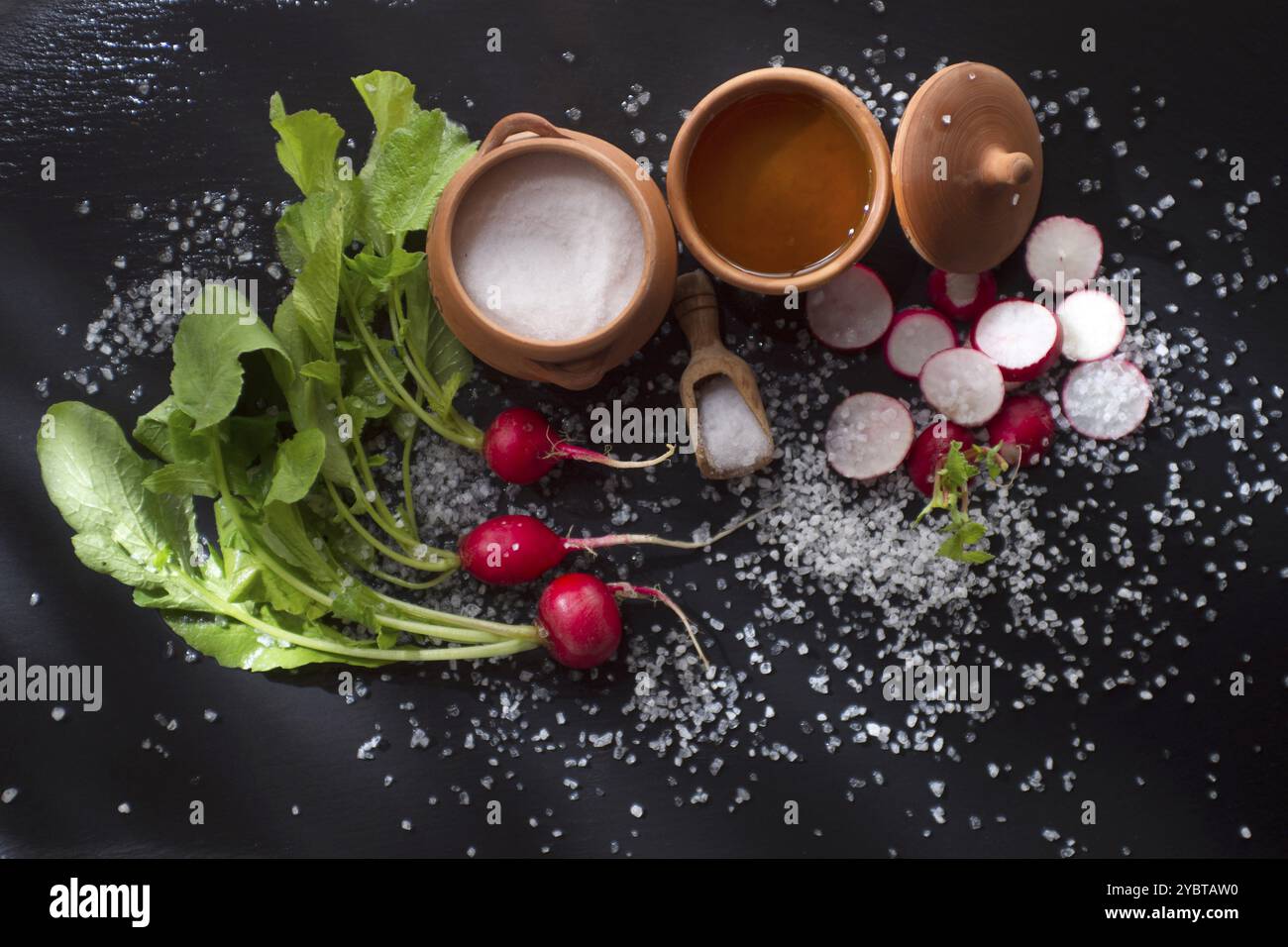 Product orchard in spring, red radish on black pumice stone Stock Photo