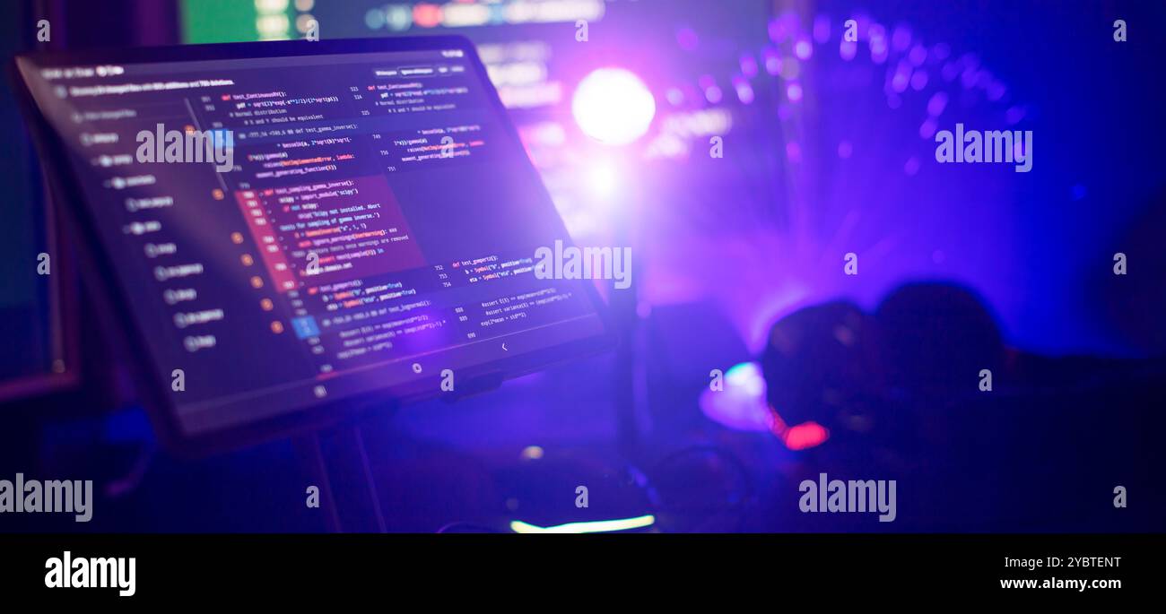 Working atmosphere of a programmer at home, background. Programming code abstract Stock Photo