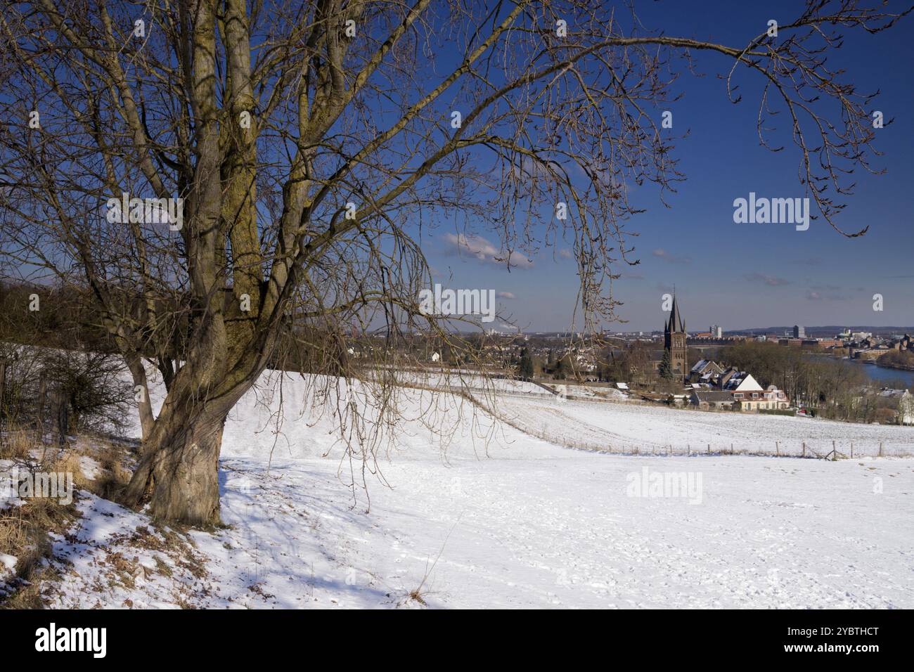 View over a snowy slope on the Church of St. Peter at the top of the St. Peter's district in Maastricht Stock Photo