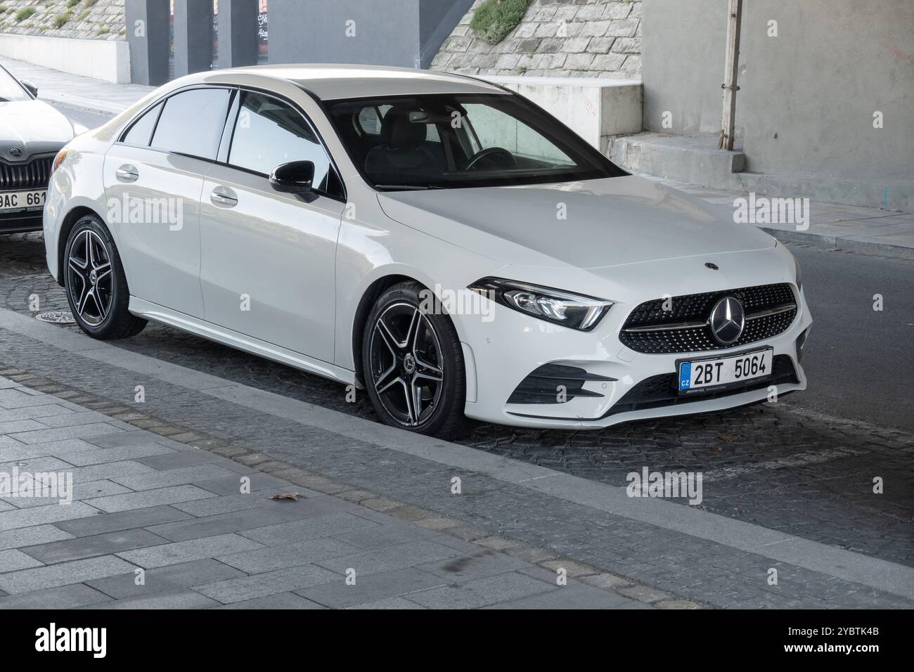 OSTRAVA, CZECHIA - SEPTEMBER 28, 2023: White Mercedes-Benz A-Class Sedan V177 parked on street Stock Photo