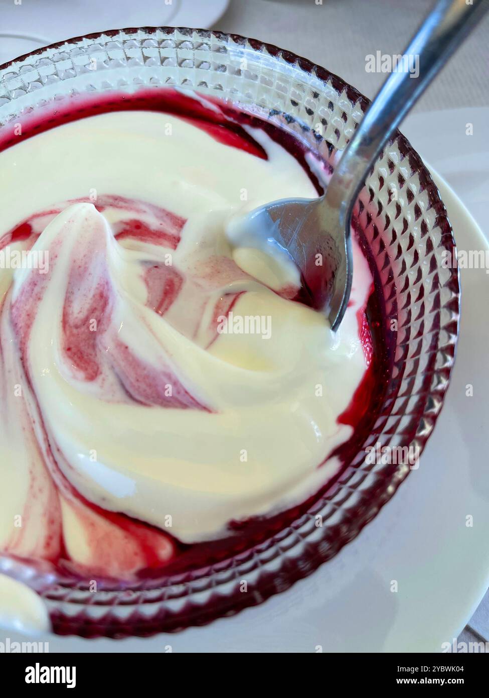 Yoghurt cream with raspberry syrup. - Smartphone Captured Stock Image