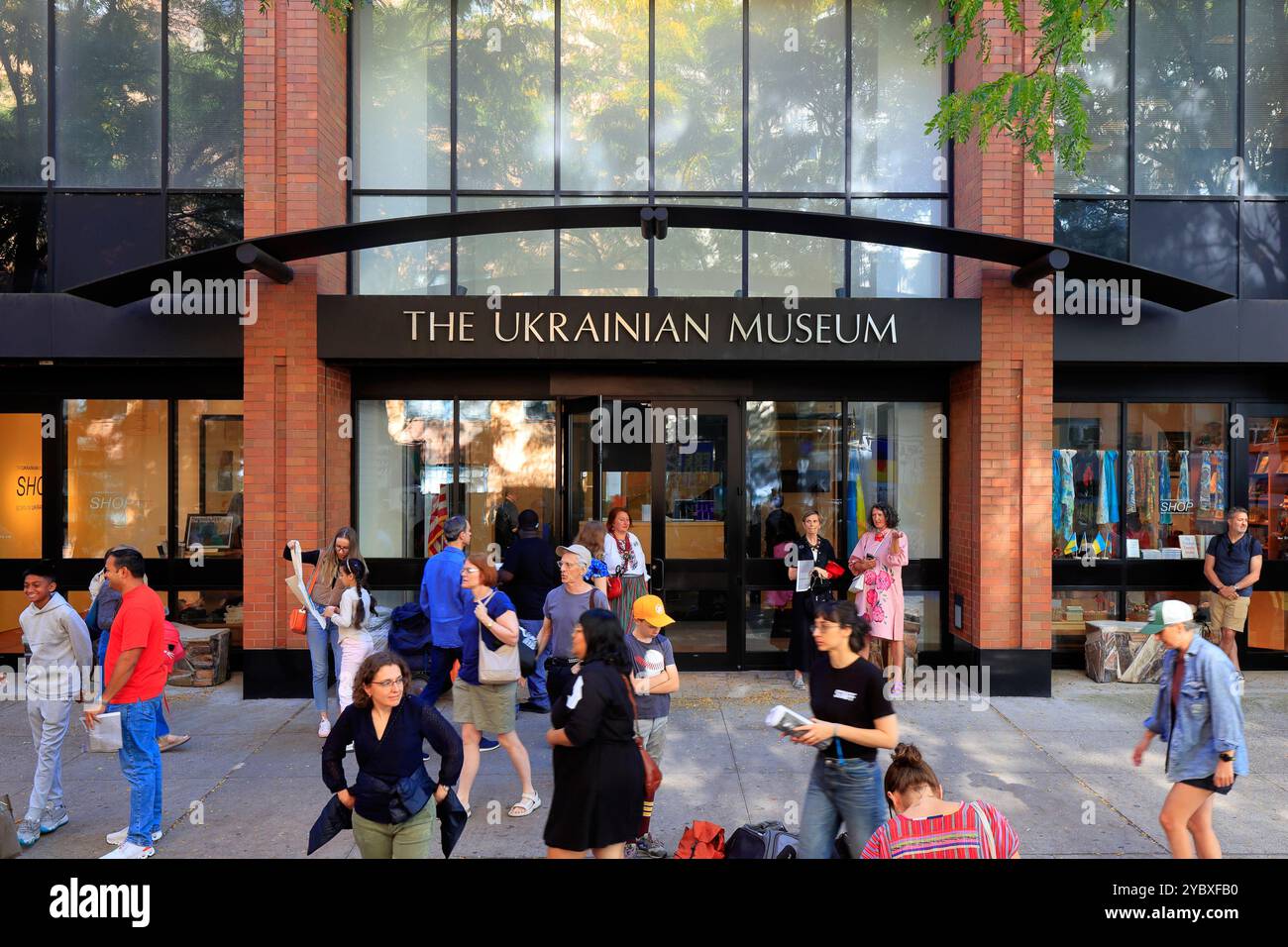 People at a community engagement event outside the Ukrainian Museum, 222 E 6th St, New York in Manhattan's East Village. Stock Photo