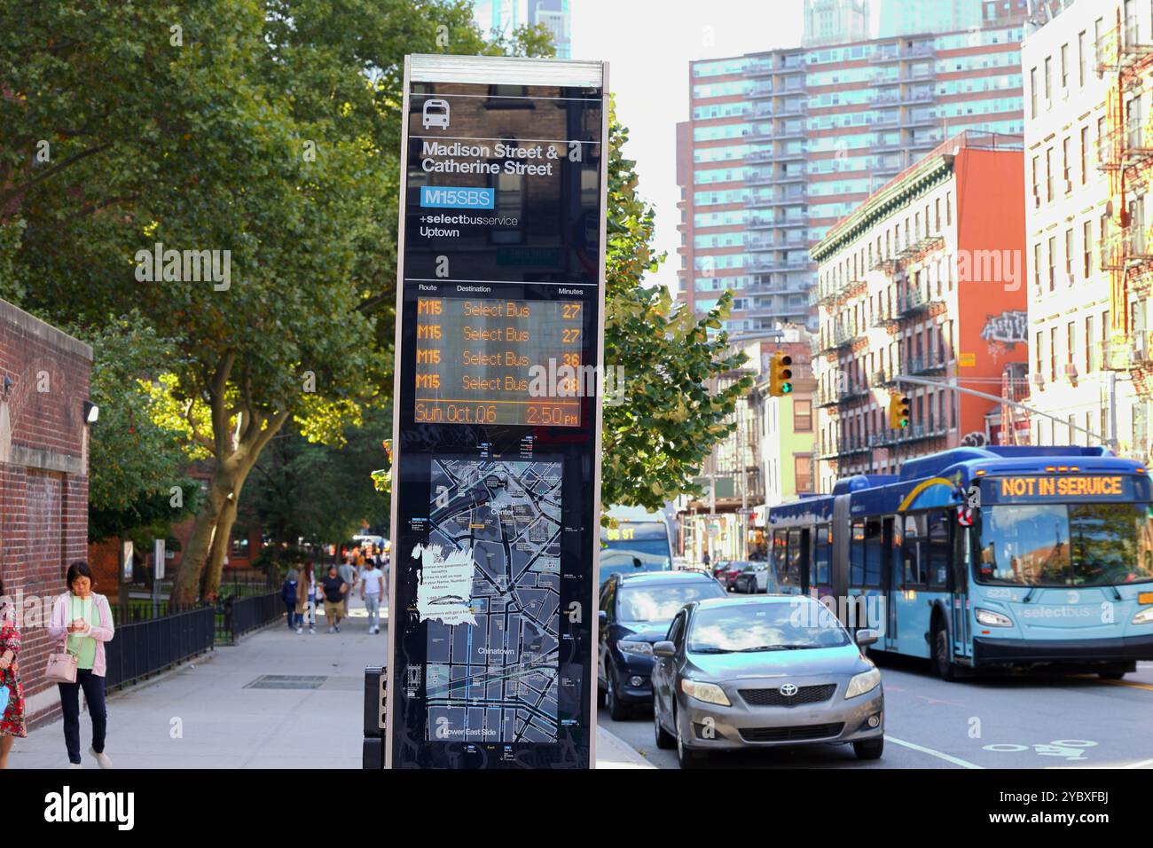 A MTA NYC Transit M15 Select Bus with a "Not In Service" display passes